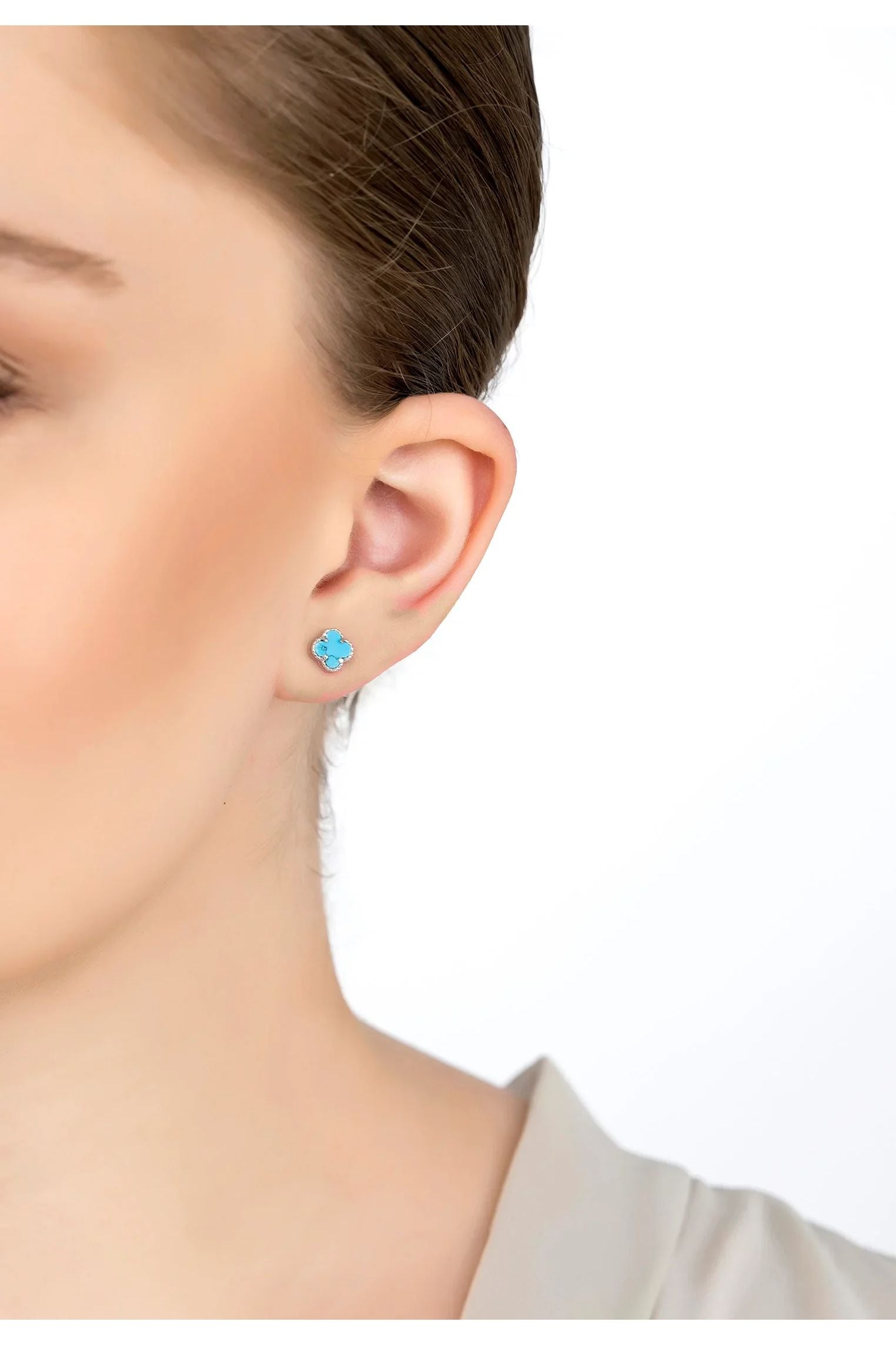 The earring worn by a model.