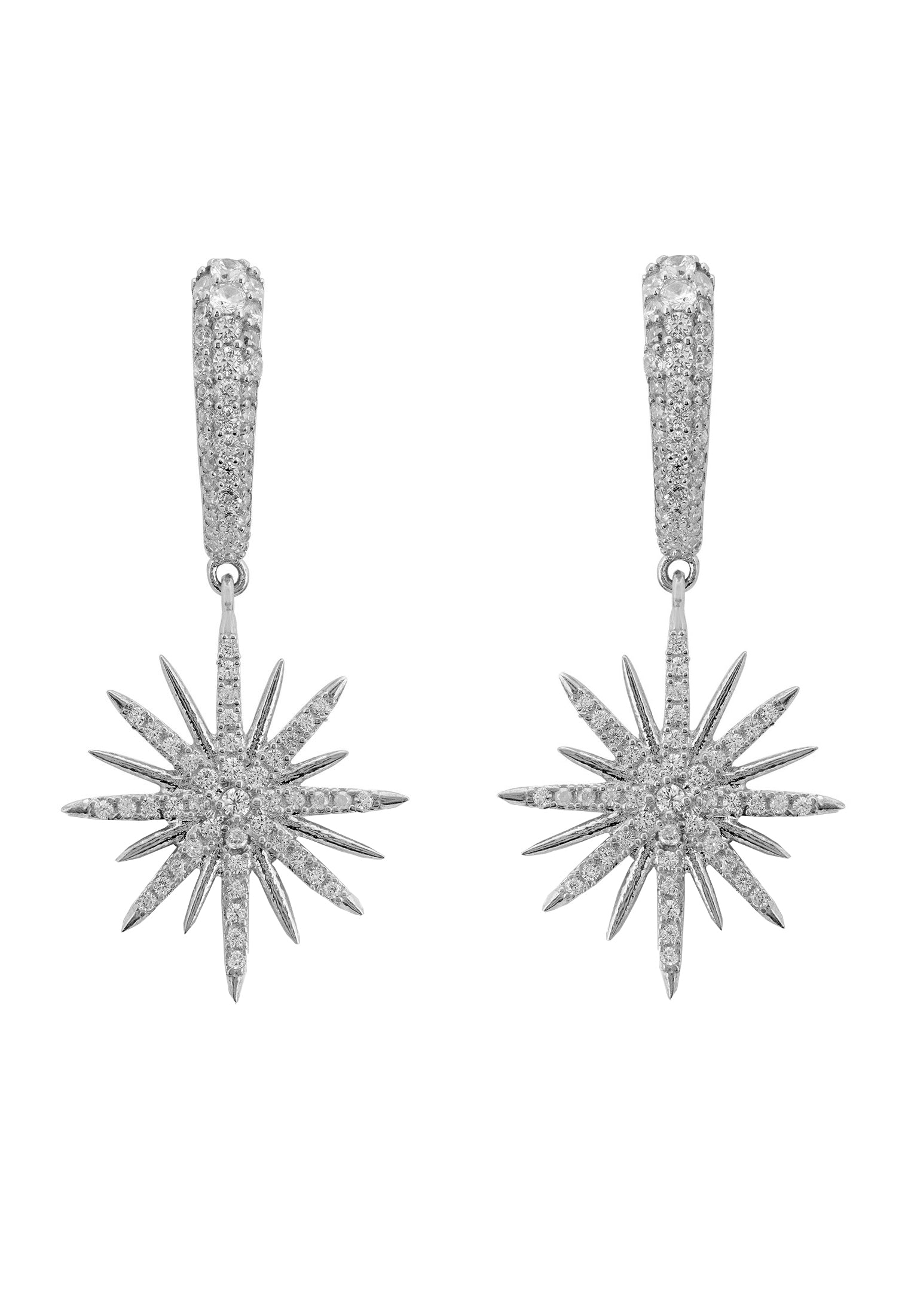 Star-shaped silver earrings with clear gemstones on a white background