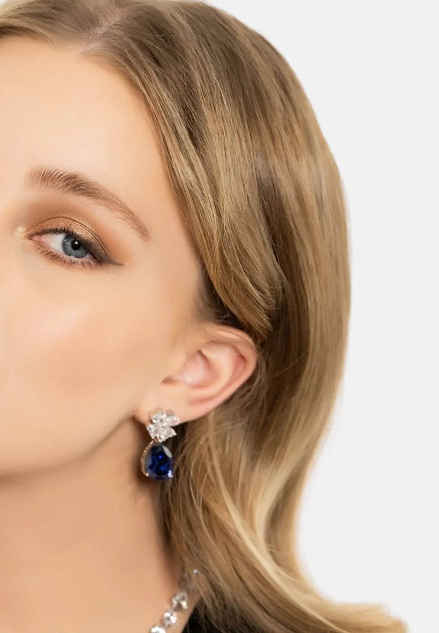 The earring worn by a model.