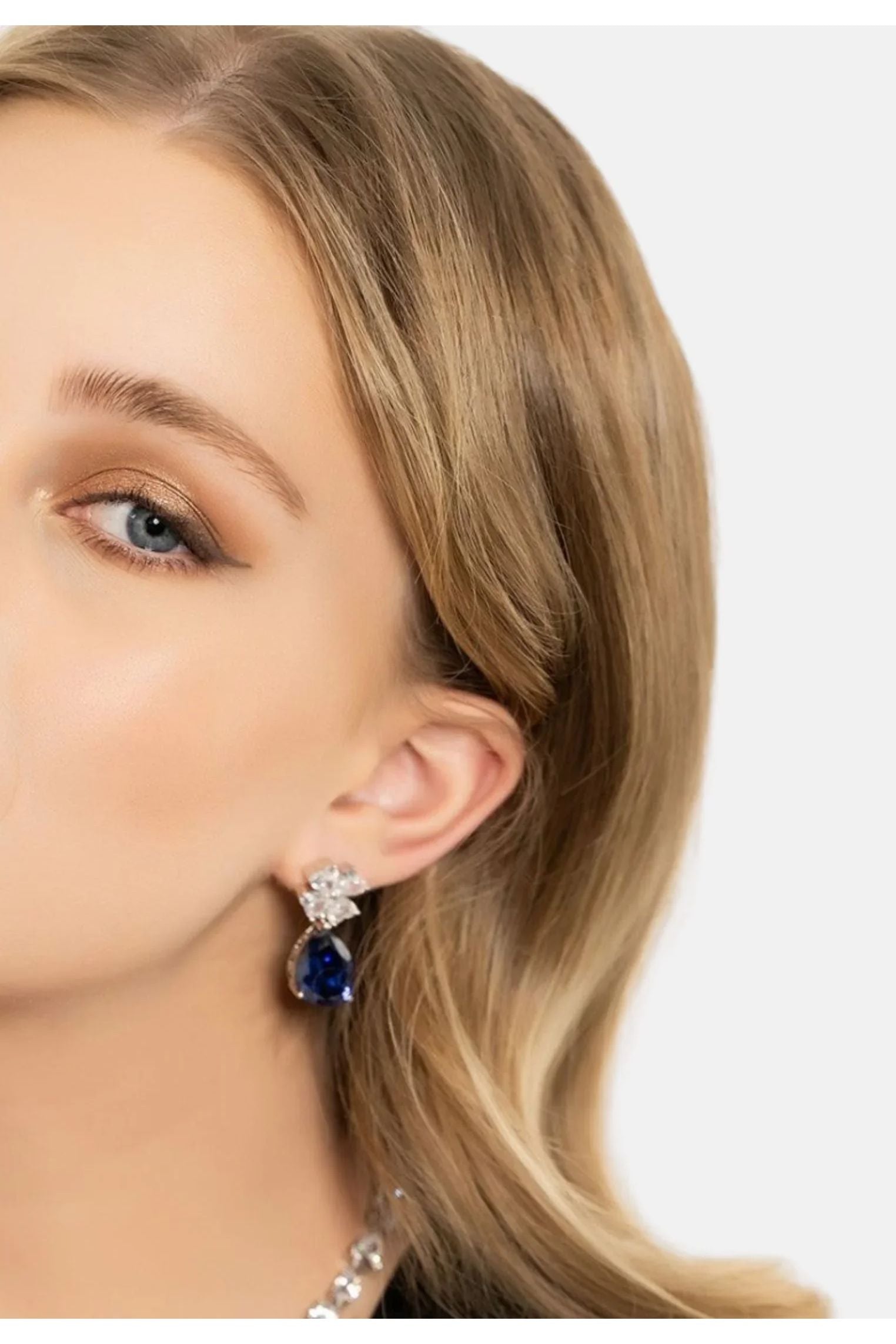 The earring worn by a model.