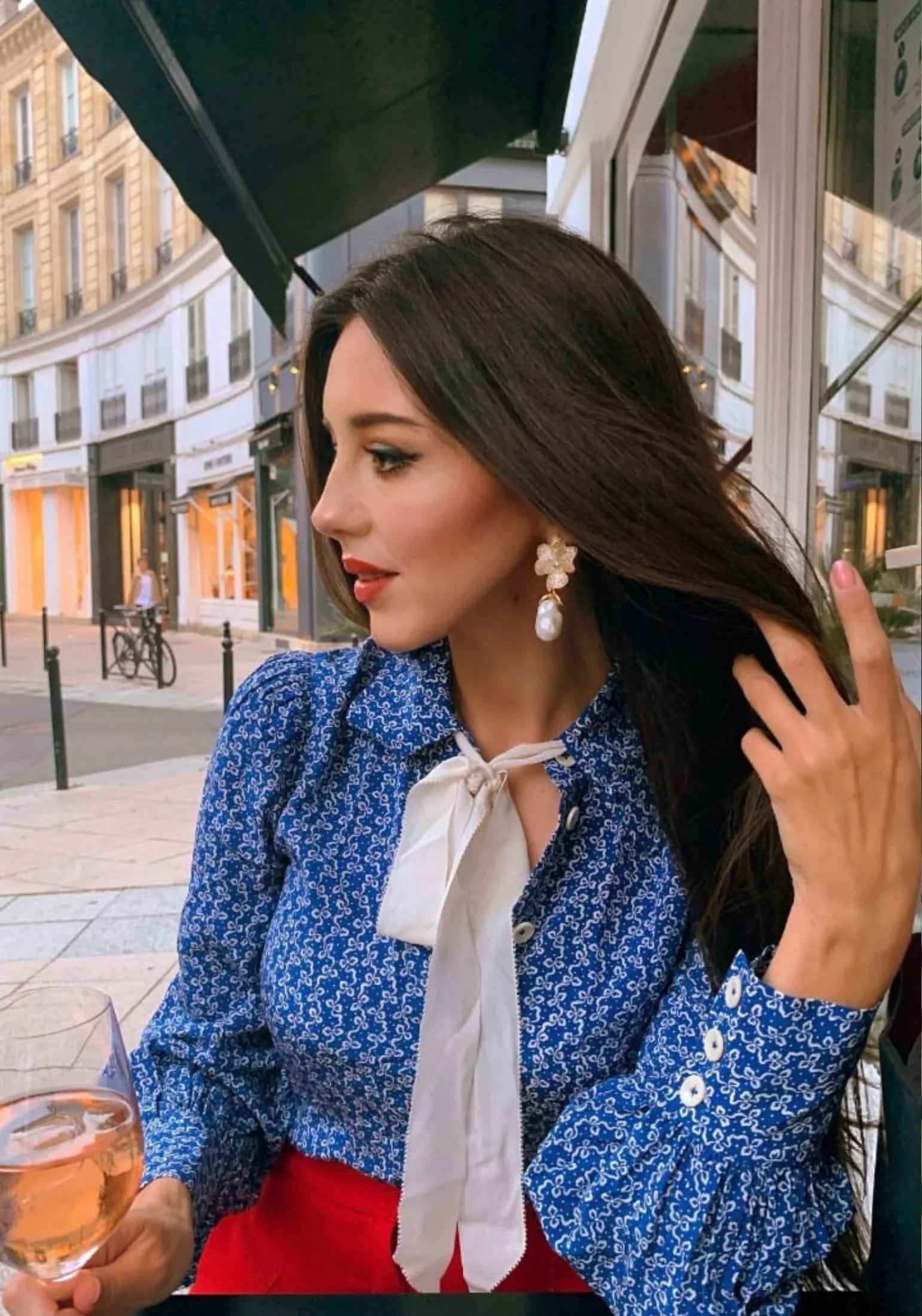 The earring worn by a model.