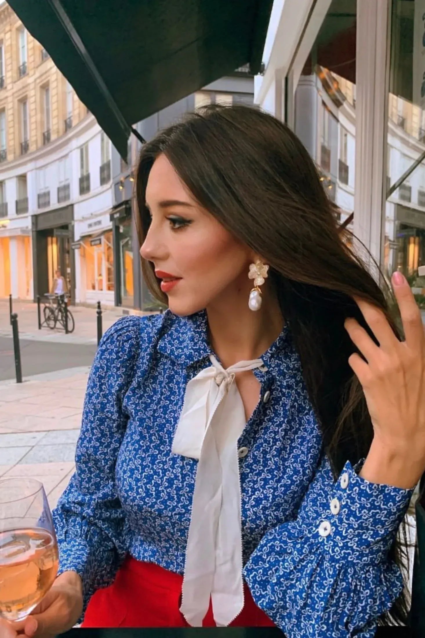 The earring worn by a model.