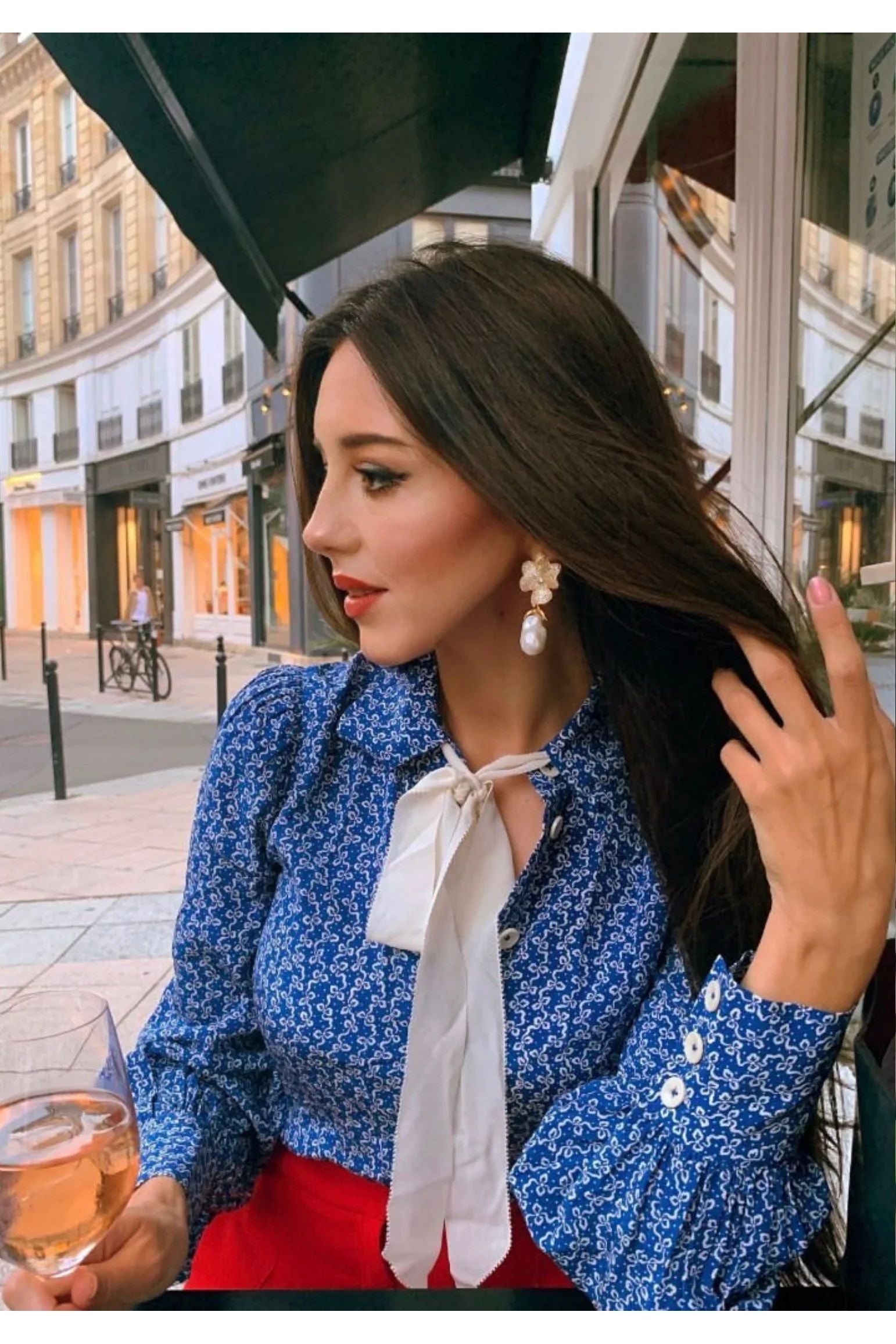 The earring worn by a model.