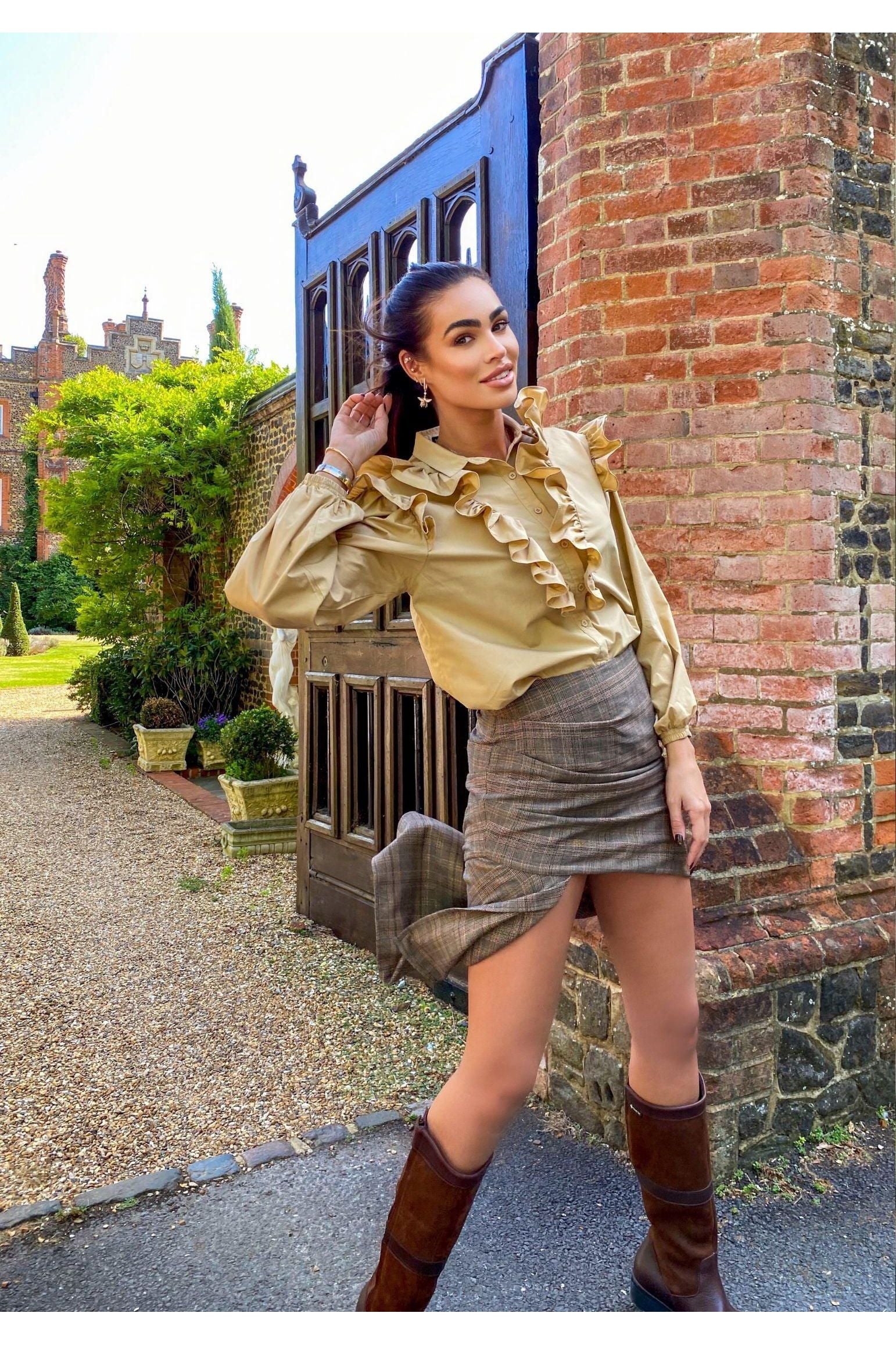 The earring worn by a model.