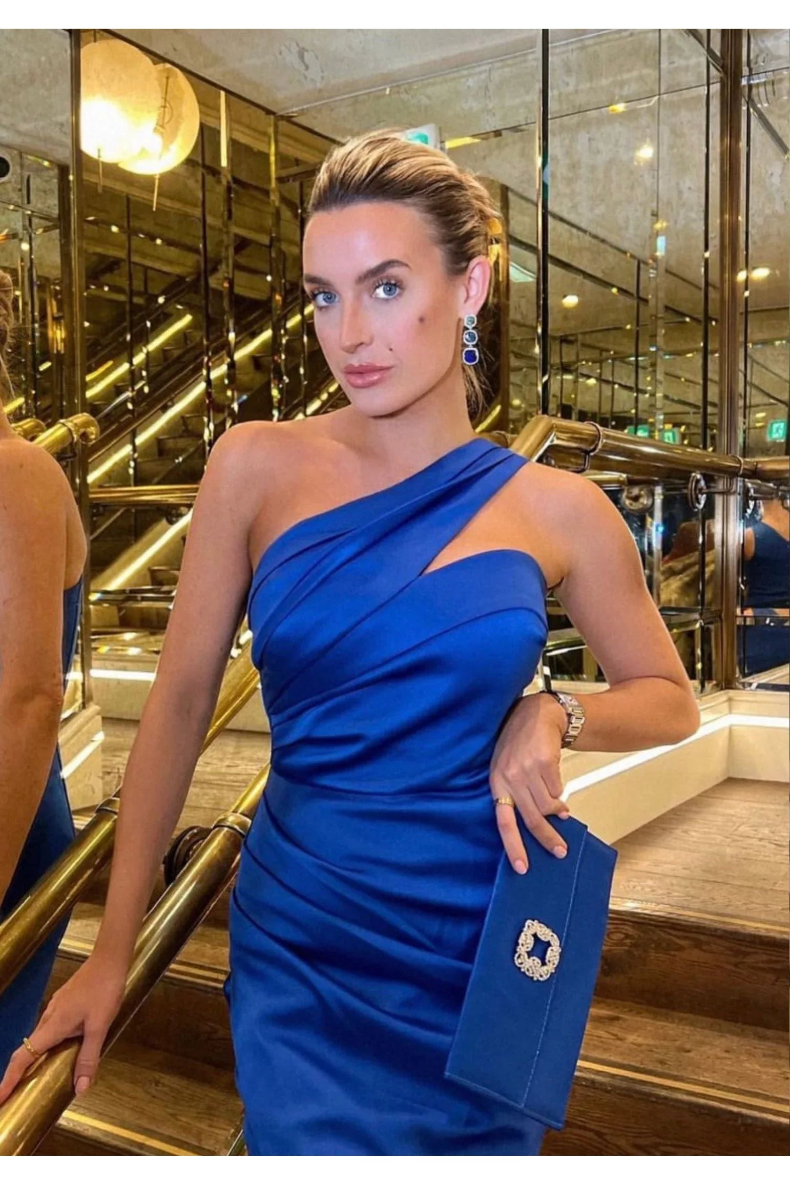 The earring worn by a model.