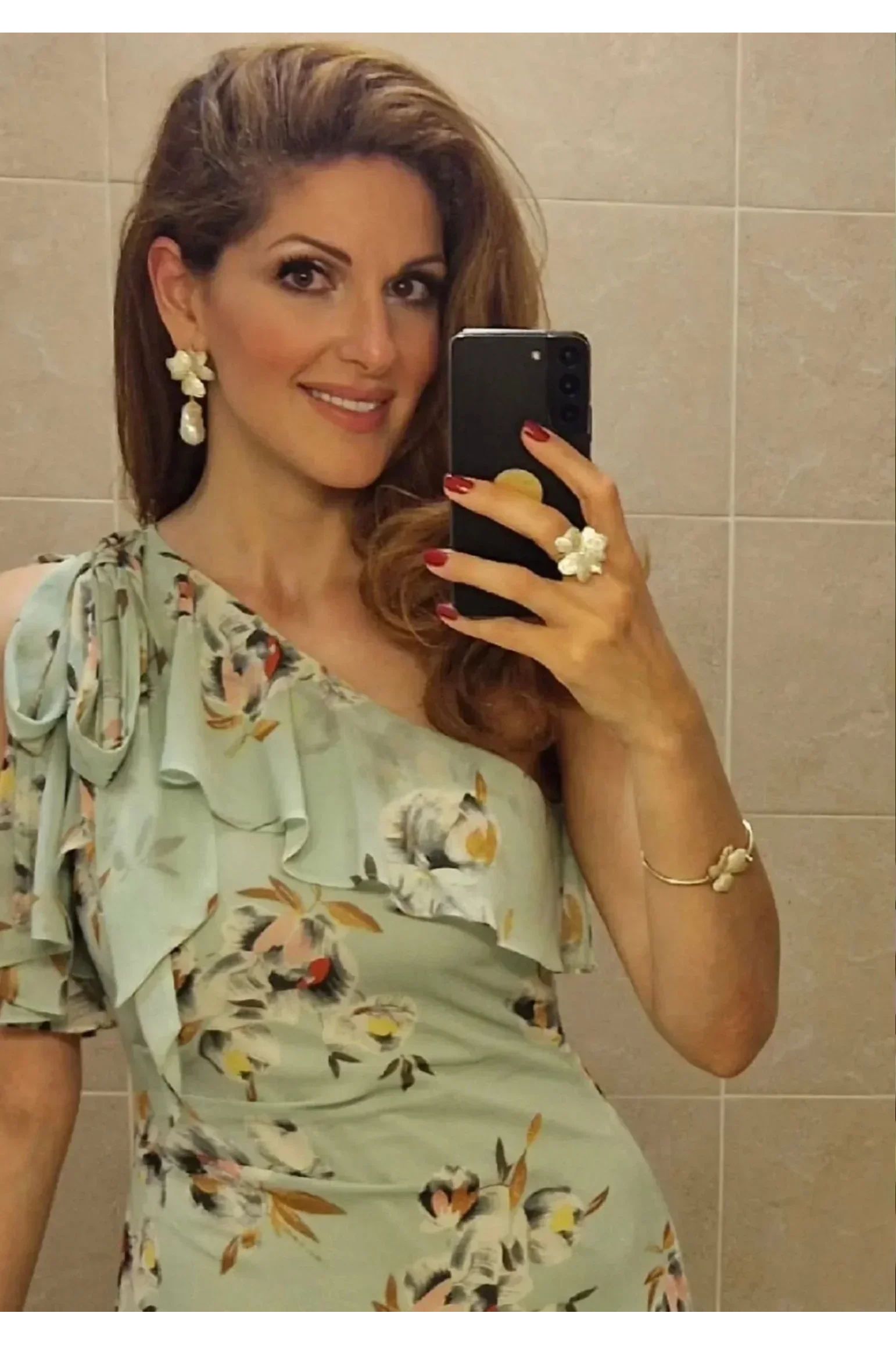 Floral jewelry set worn by a model.