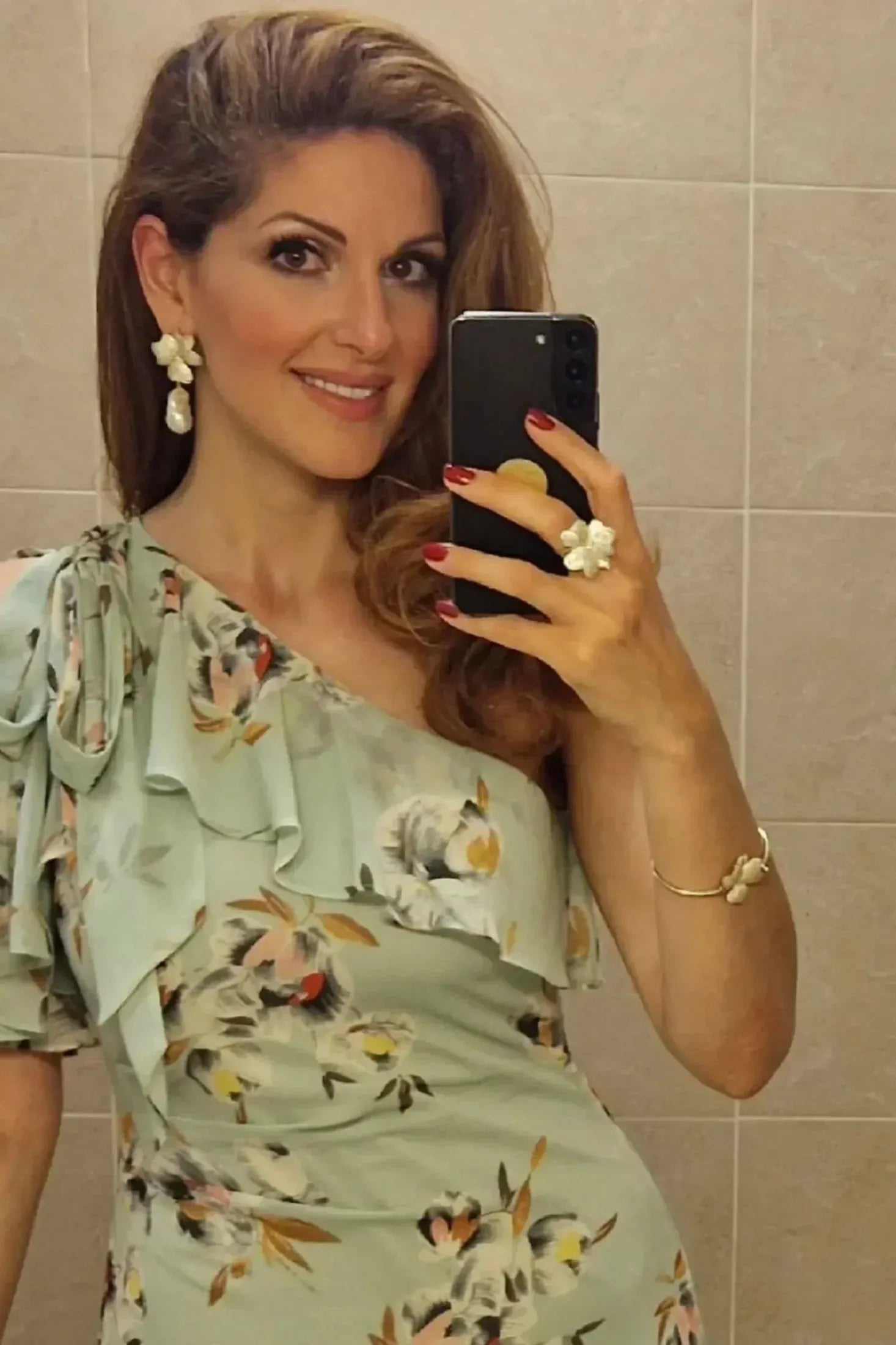 Floral jewelry set worn by a model.