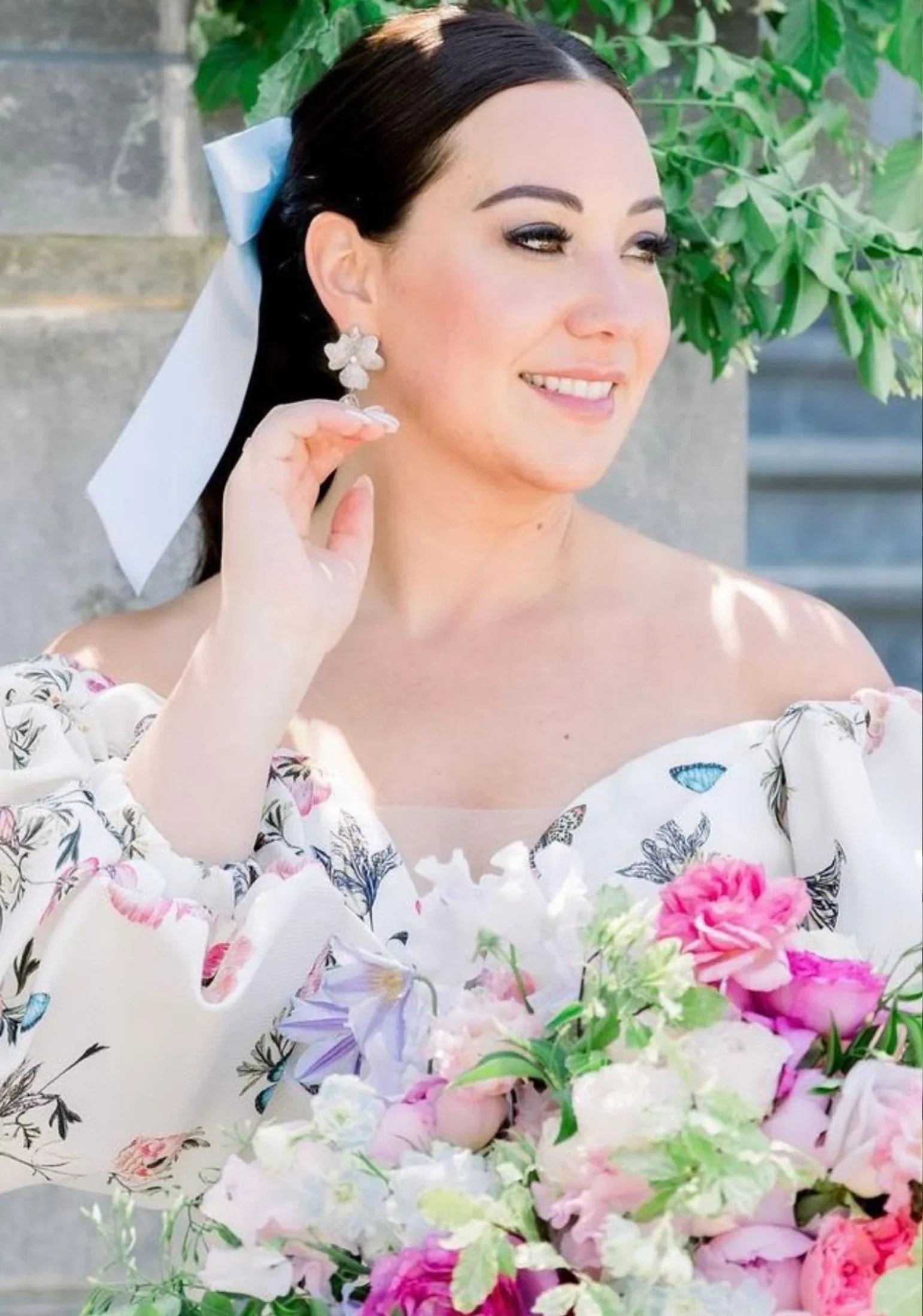 The earring worn by a model.