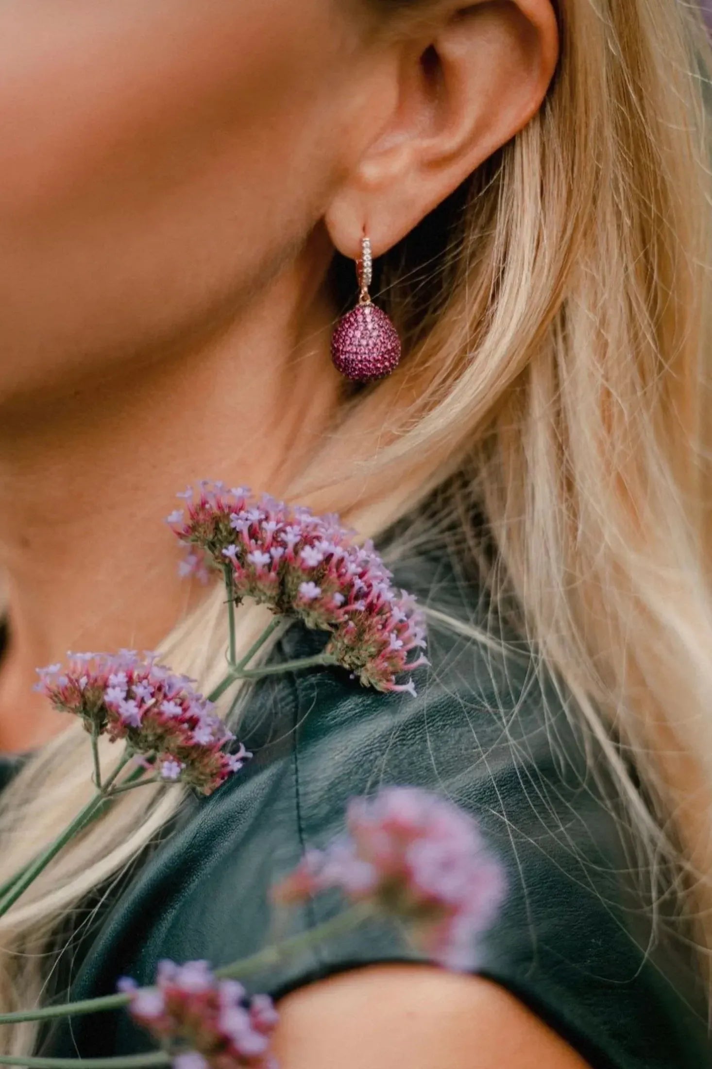 The earring worn by a model.