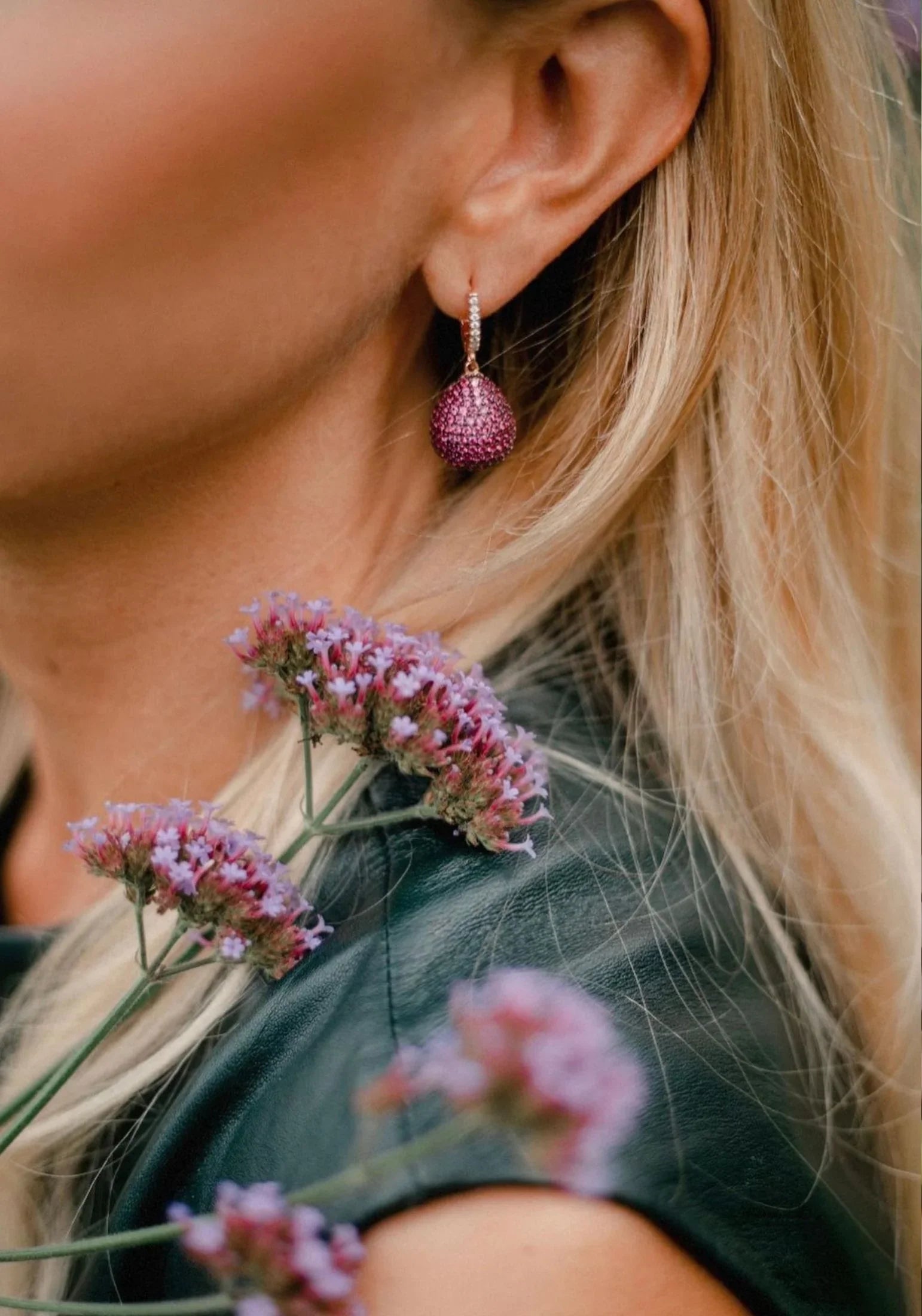 The earring worn by a model.