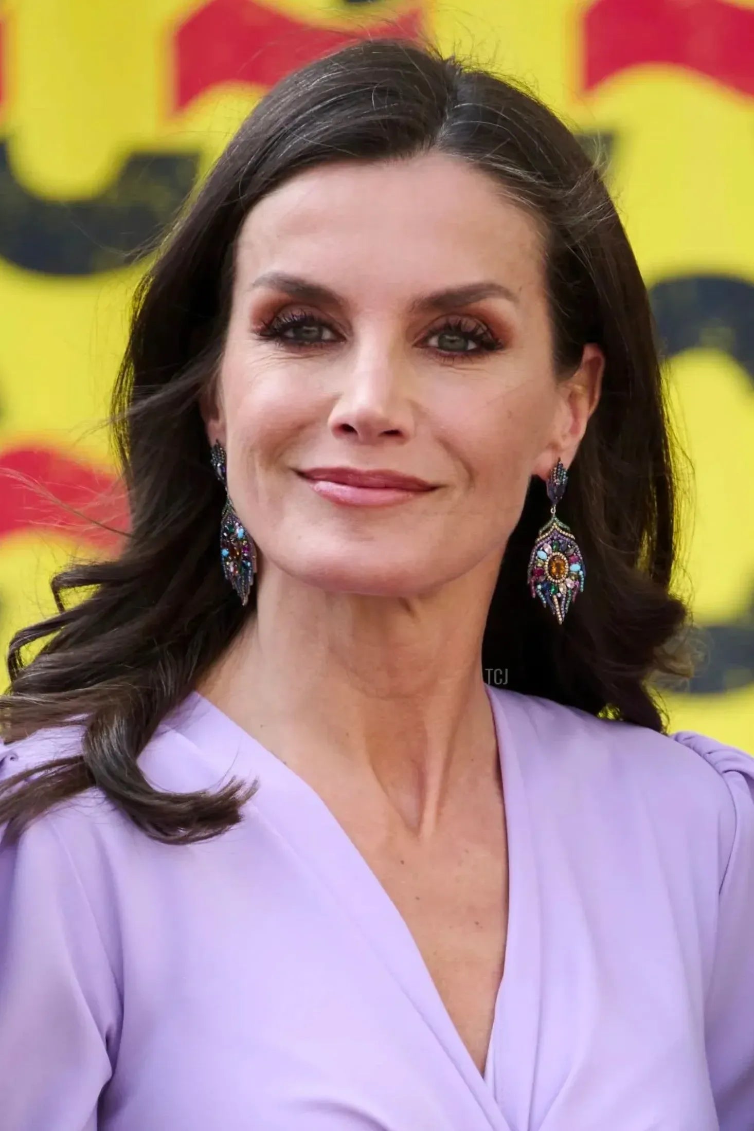 The earrings worn by a model.