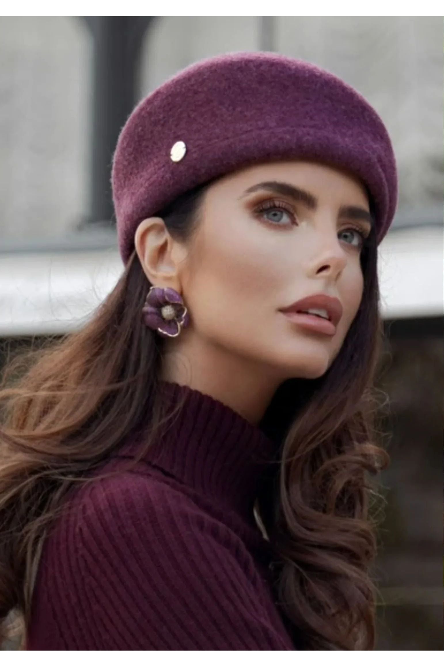 The earring worn by a model.