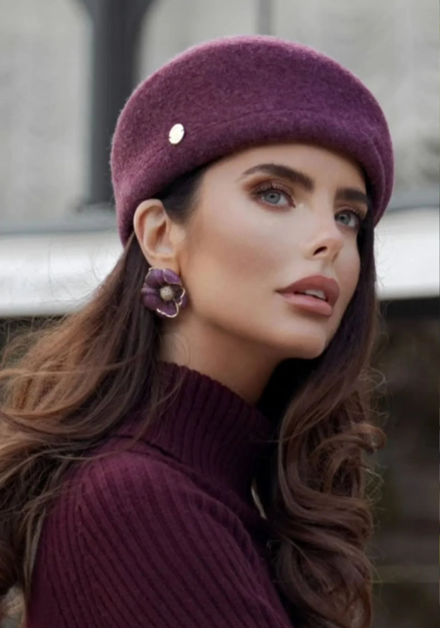 The earring worn by a model.