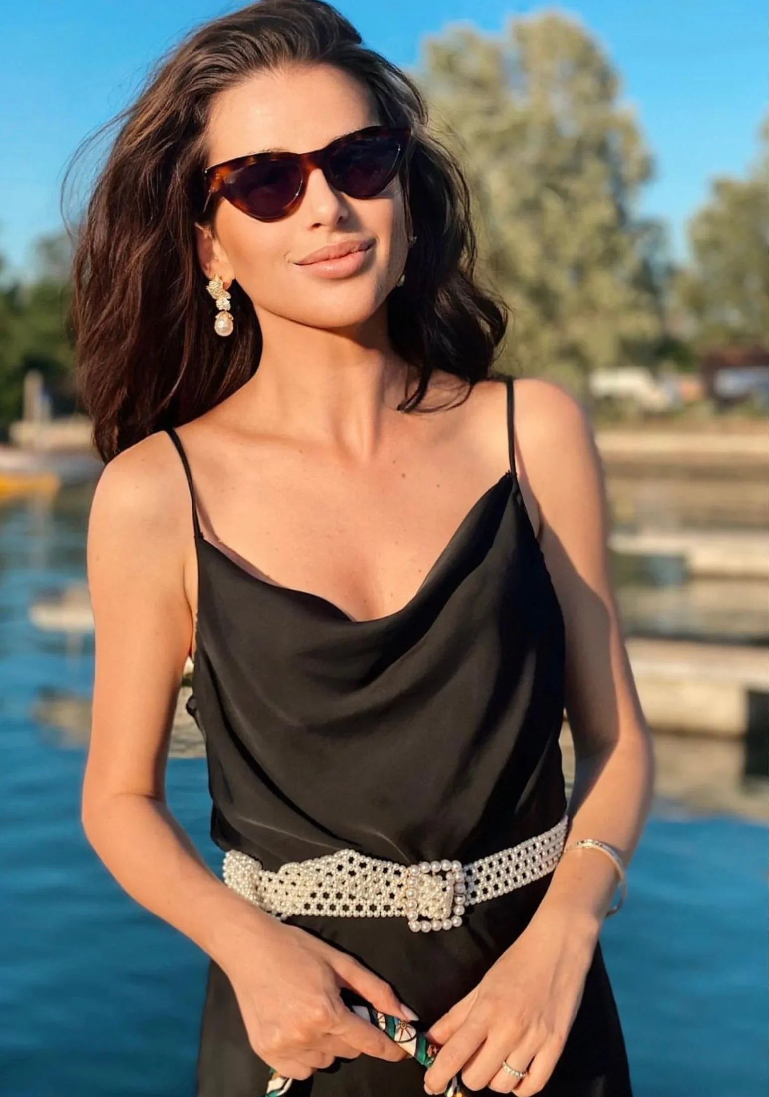 The earring worn by a model.