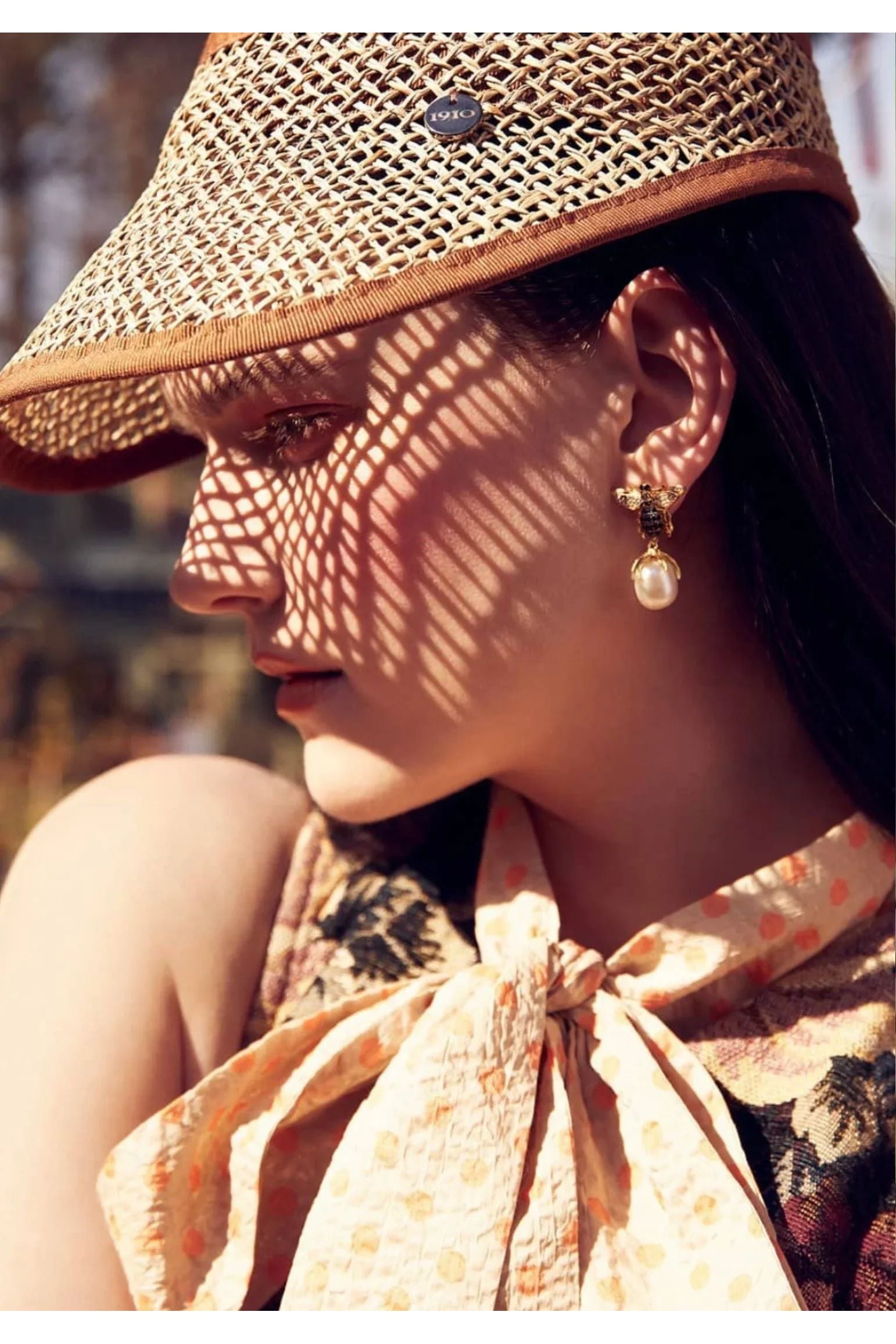 The earring worn by a model.