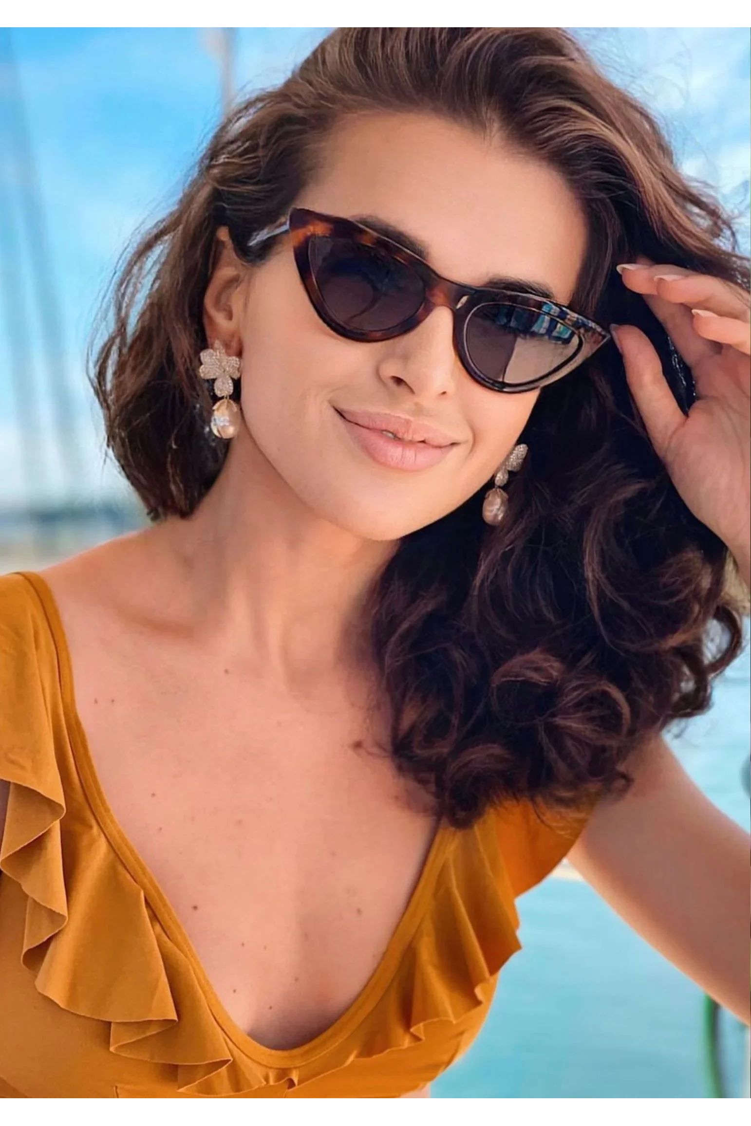 The earring worn by a model.