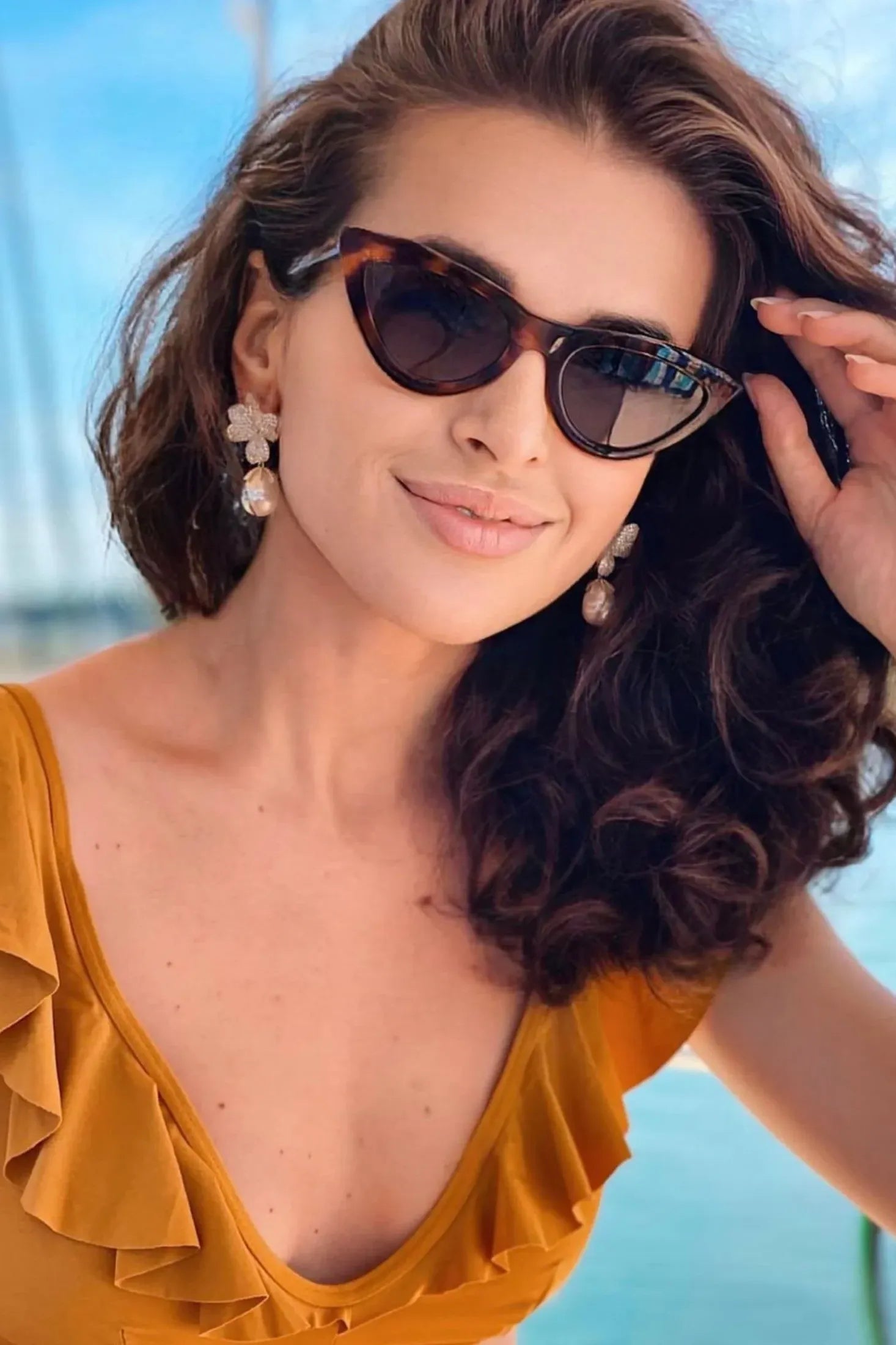 The earring worn by a model.