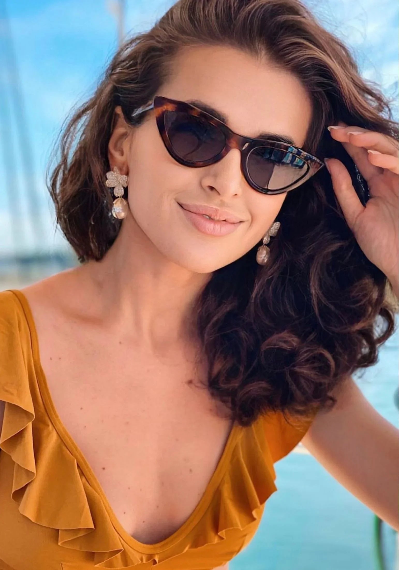 The earring worn by a model.