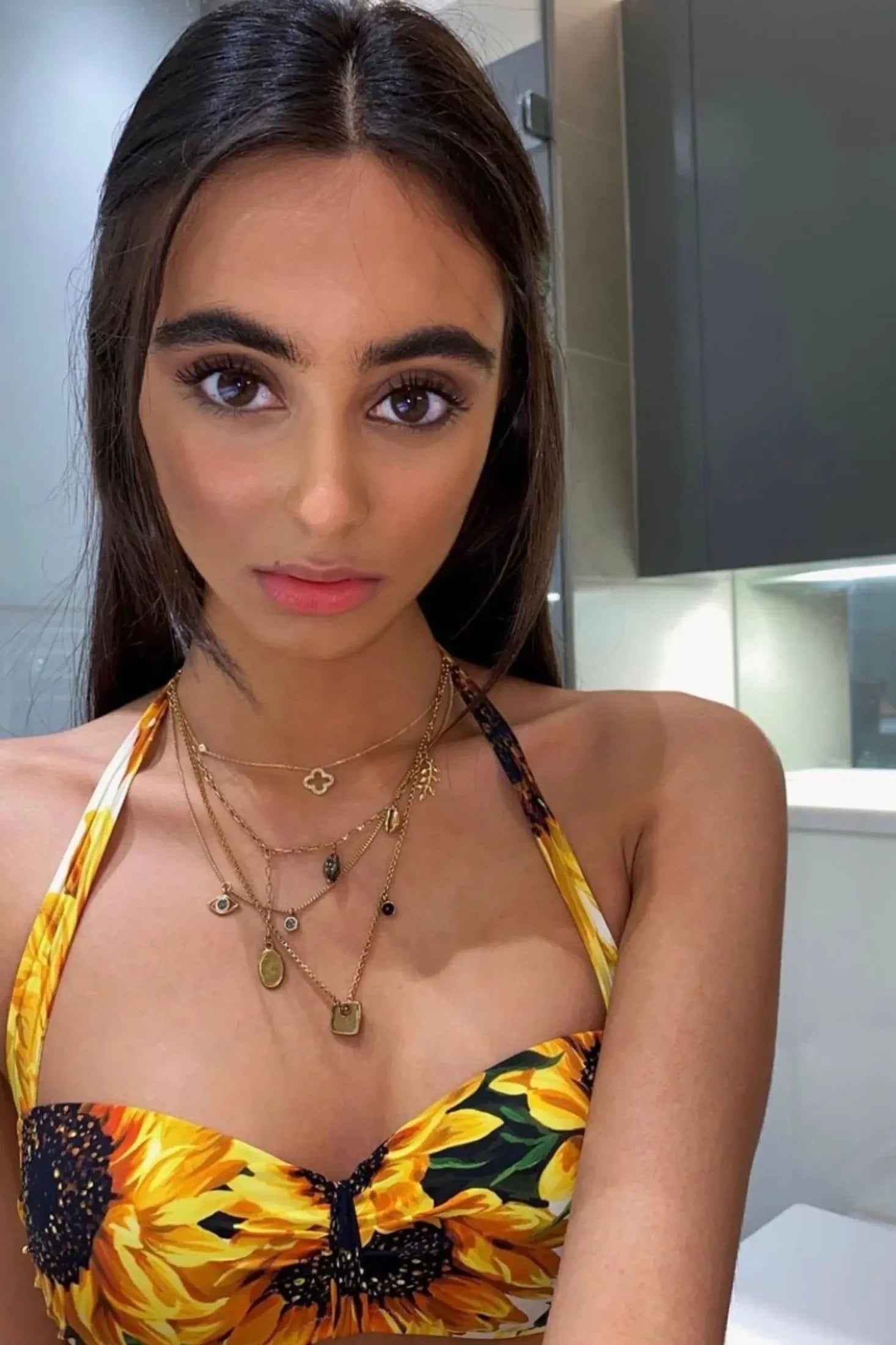 The necklace worn by a model.