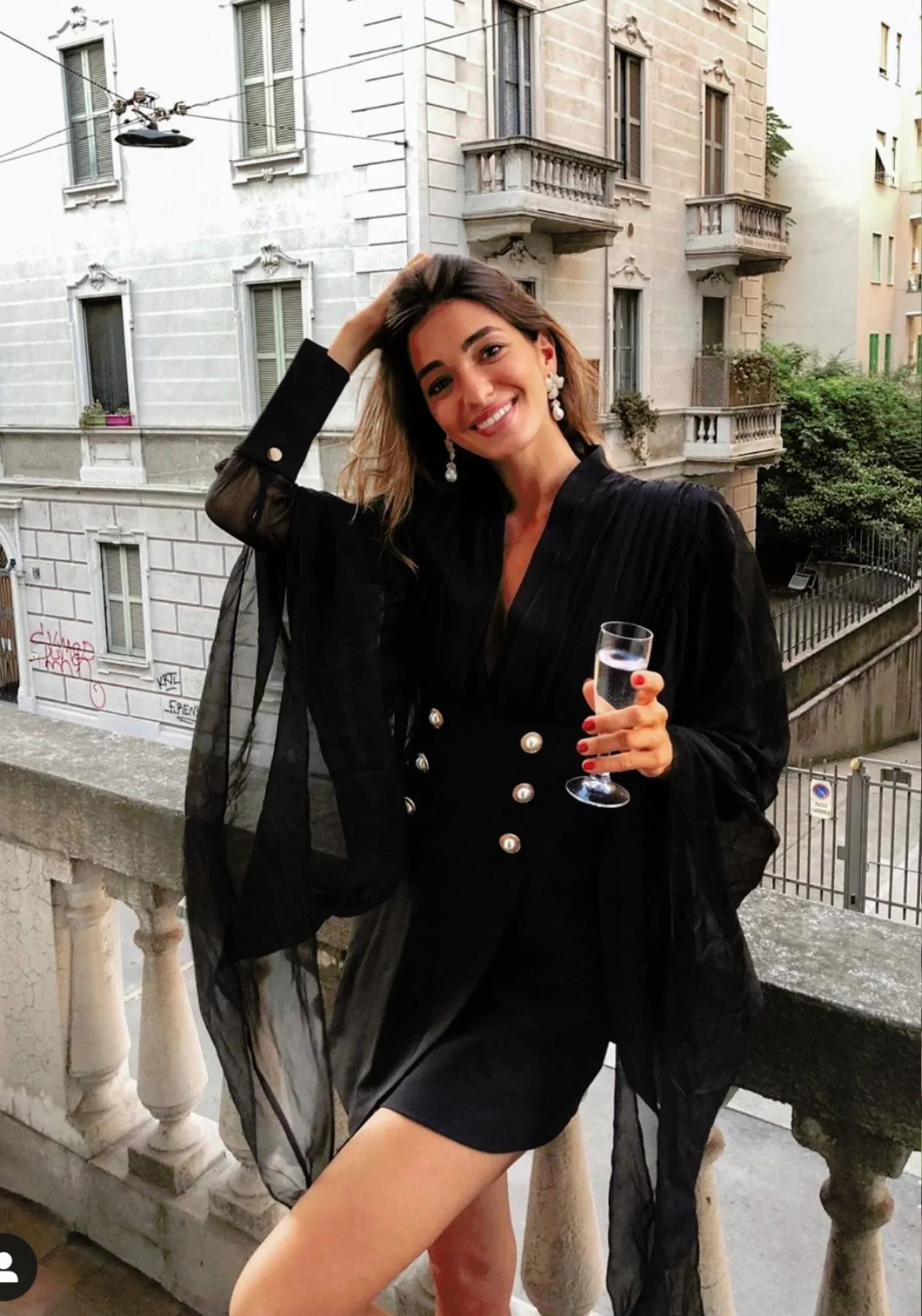 The earring worn by a model.