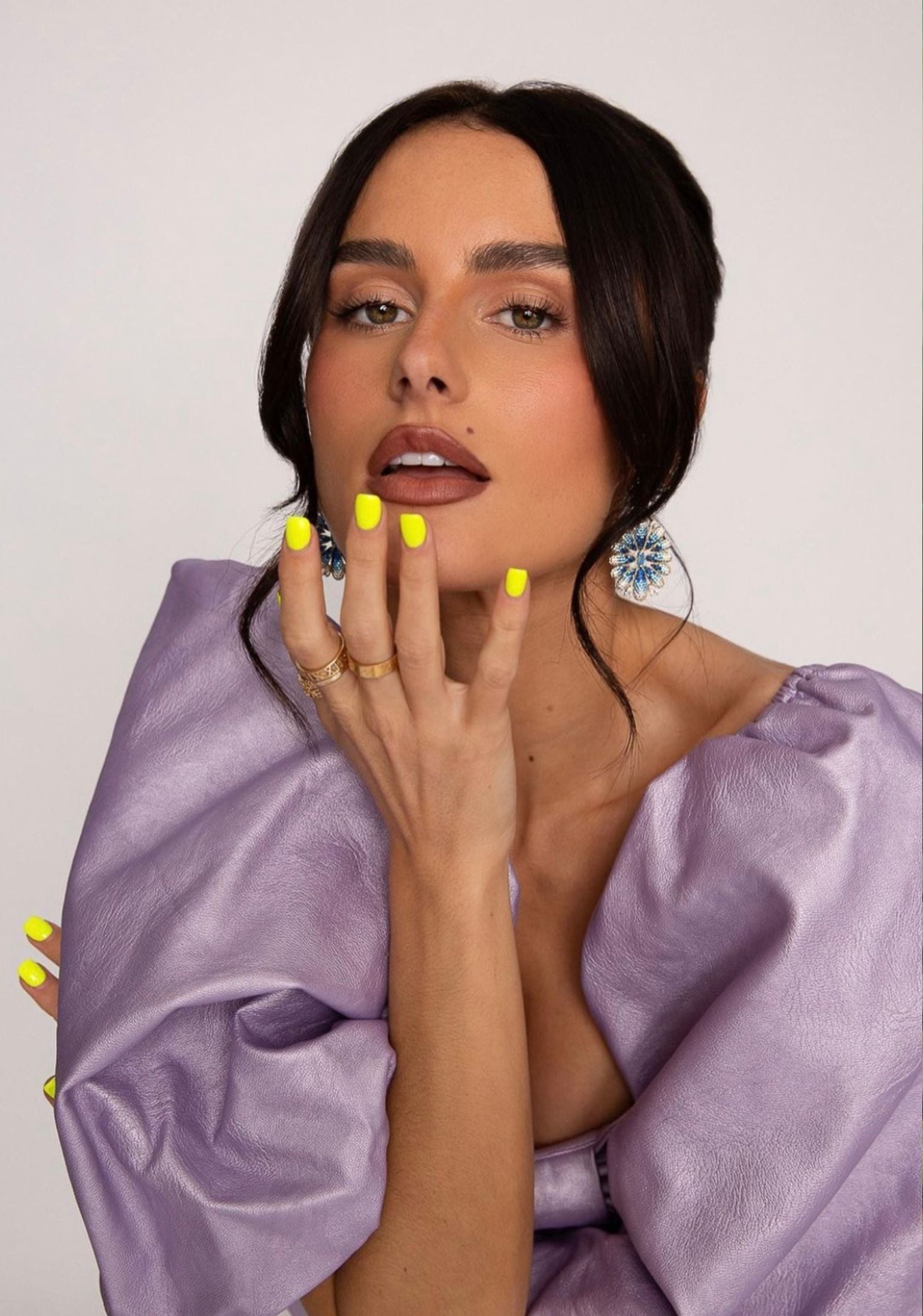 The earring worn by a model.