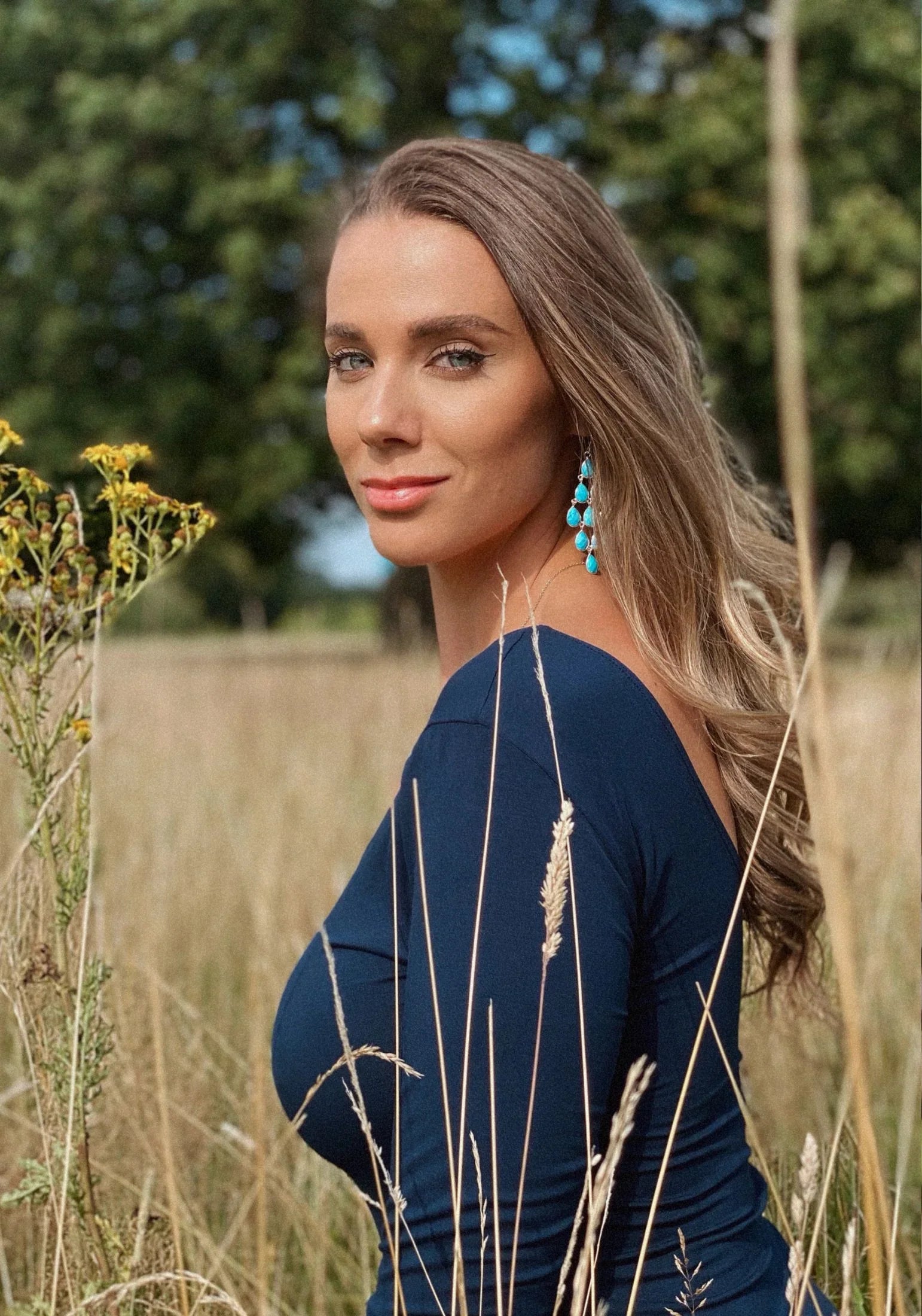 The earring worn by a model.