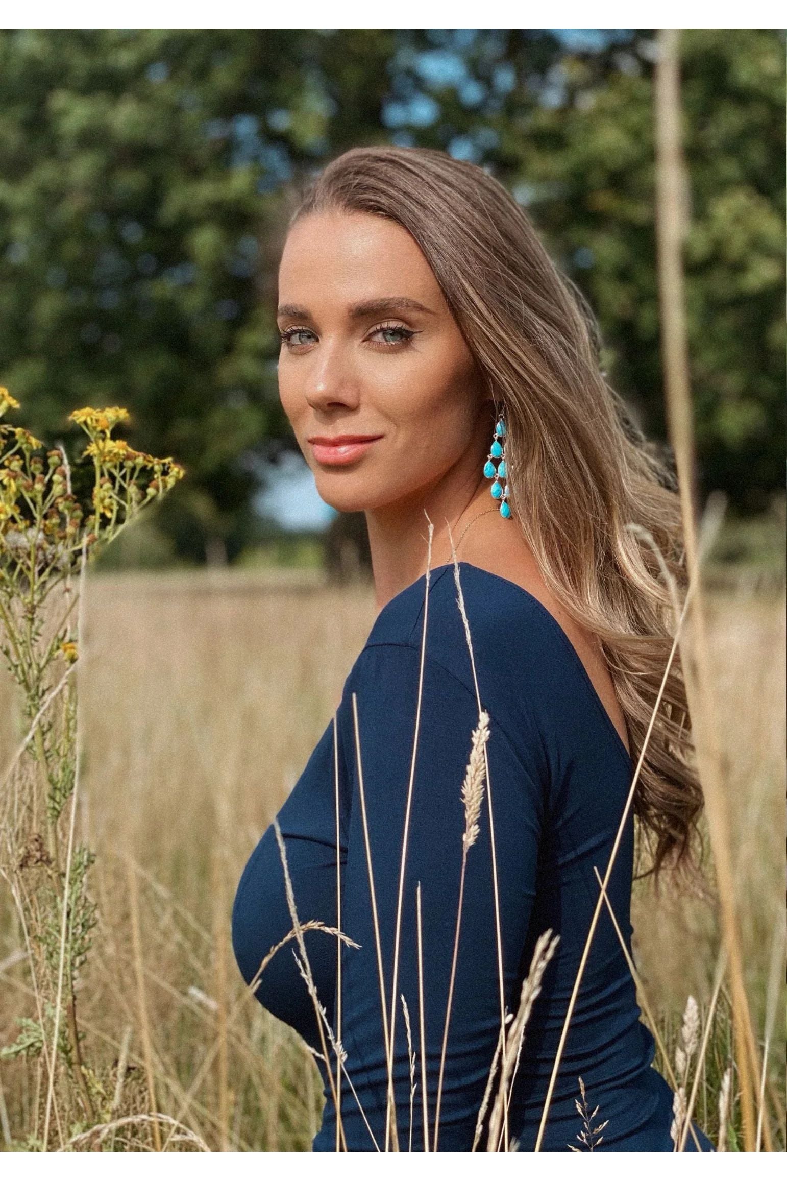 The earring worn by a model.