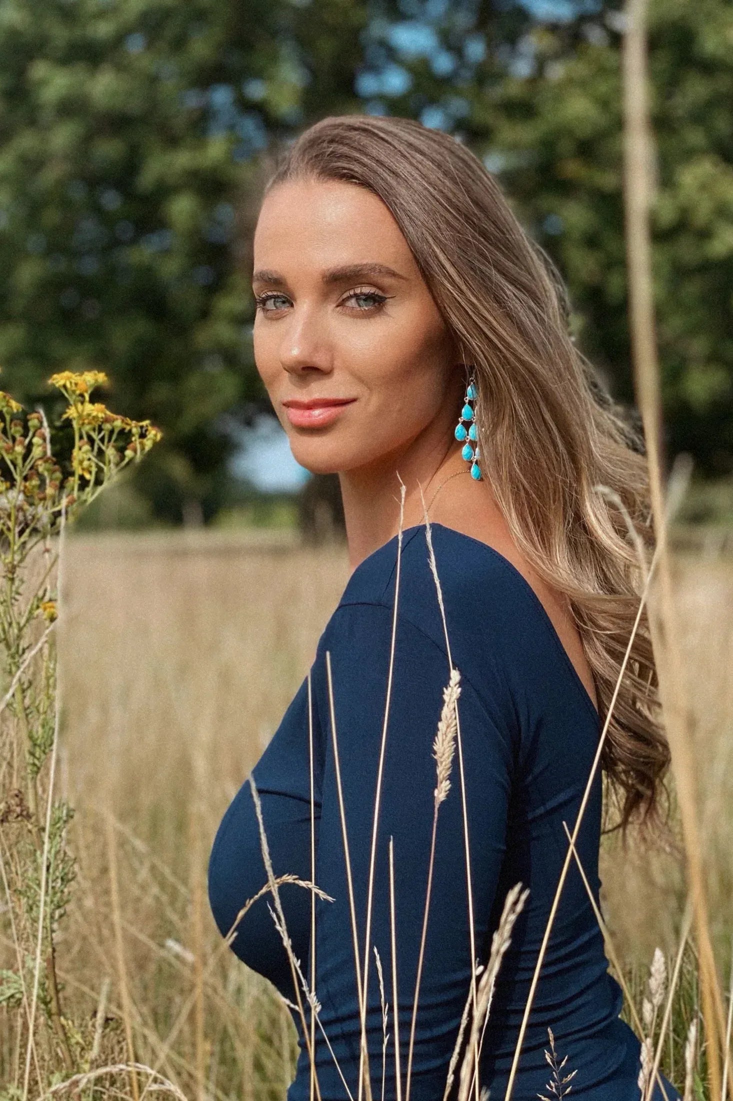 The earring worn by a model.
