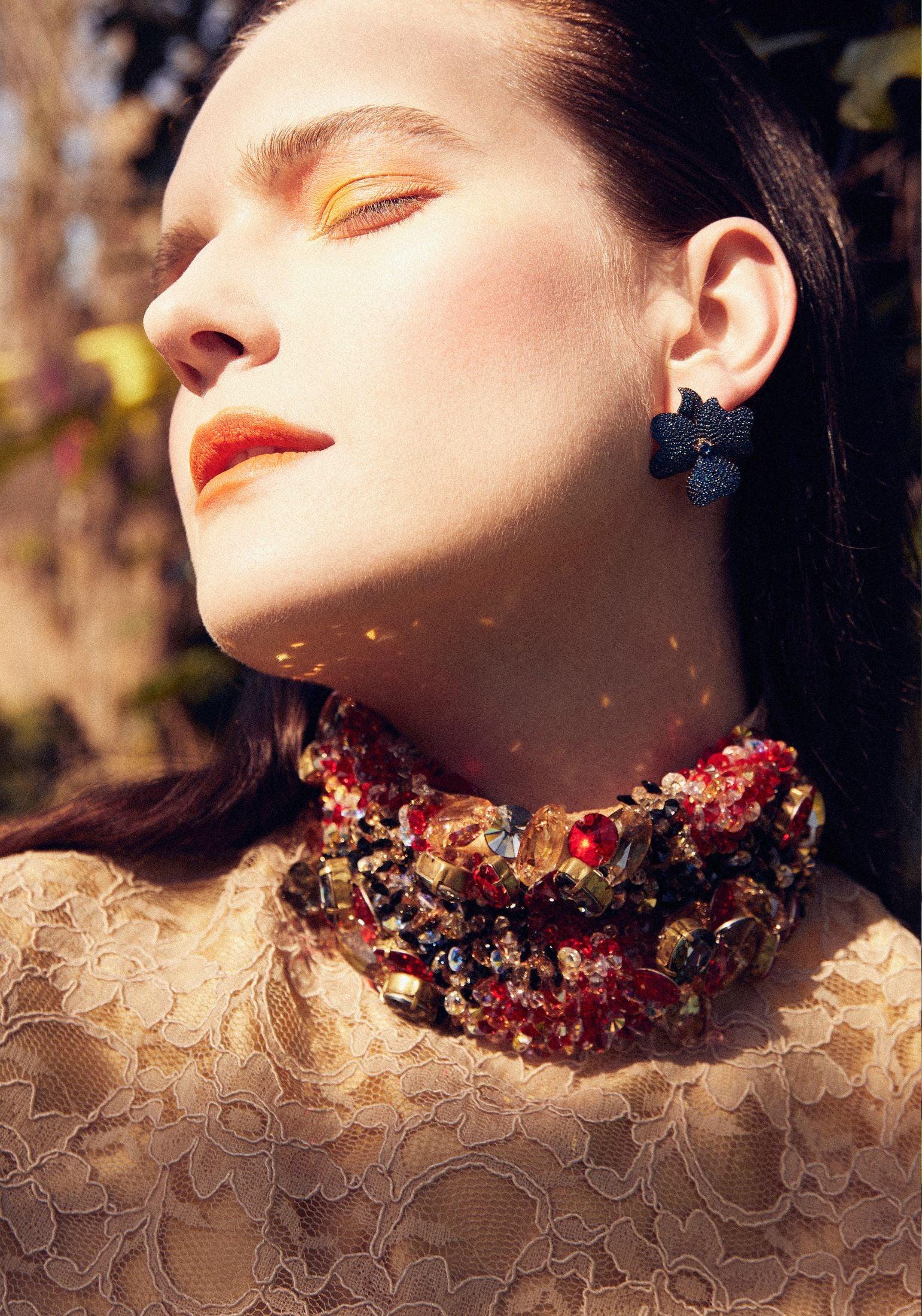The earring worn by a model.