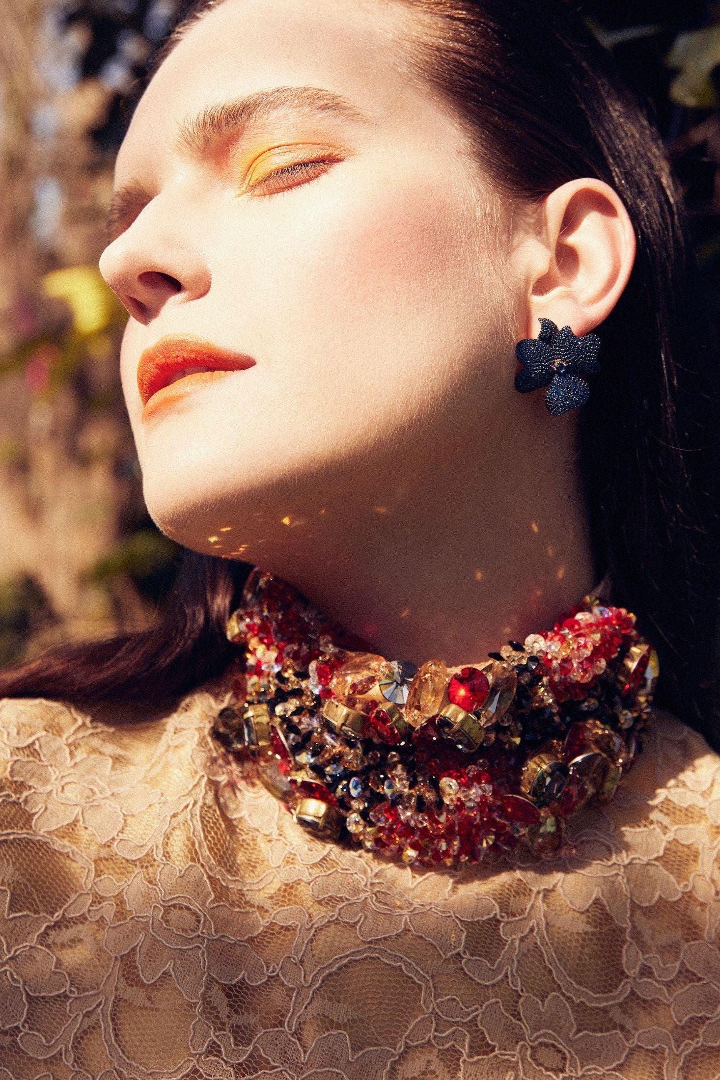 The earring worn by a model.