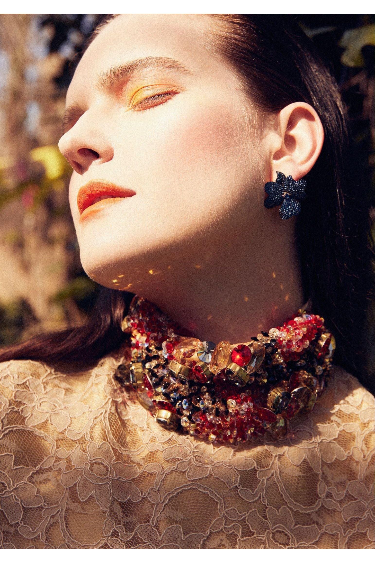 The earring worn by a model.