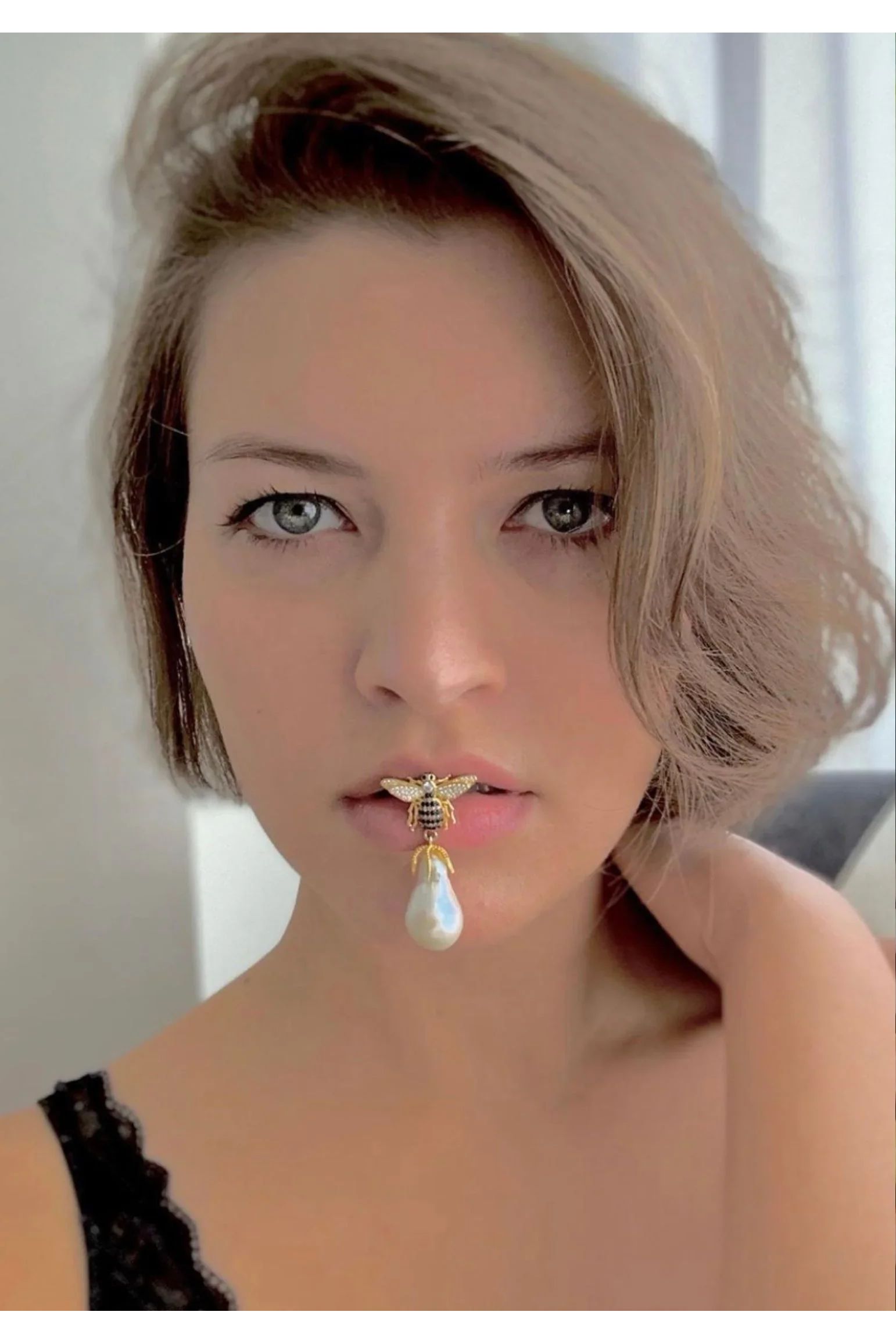 The earring worn by a model.