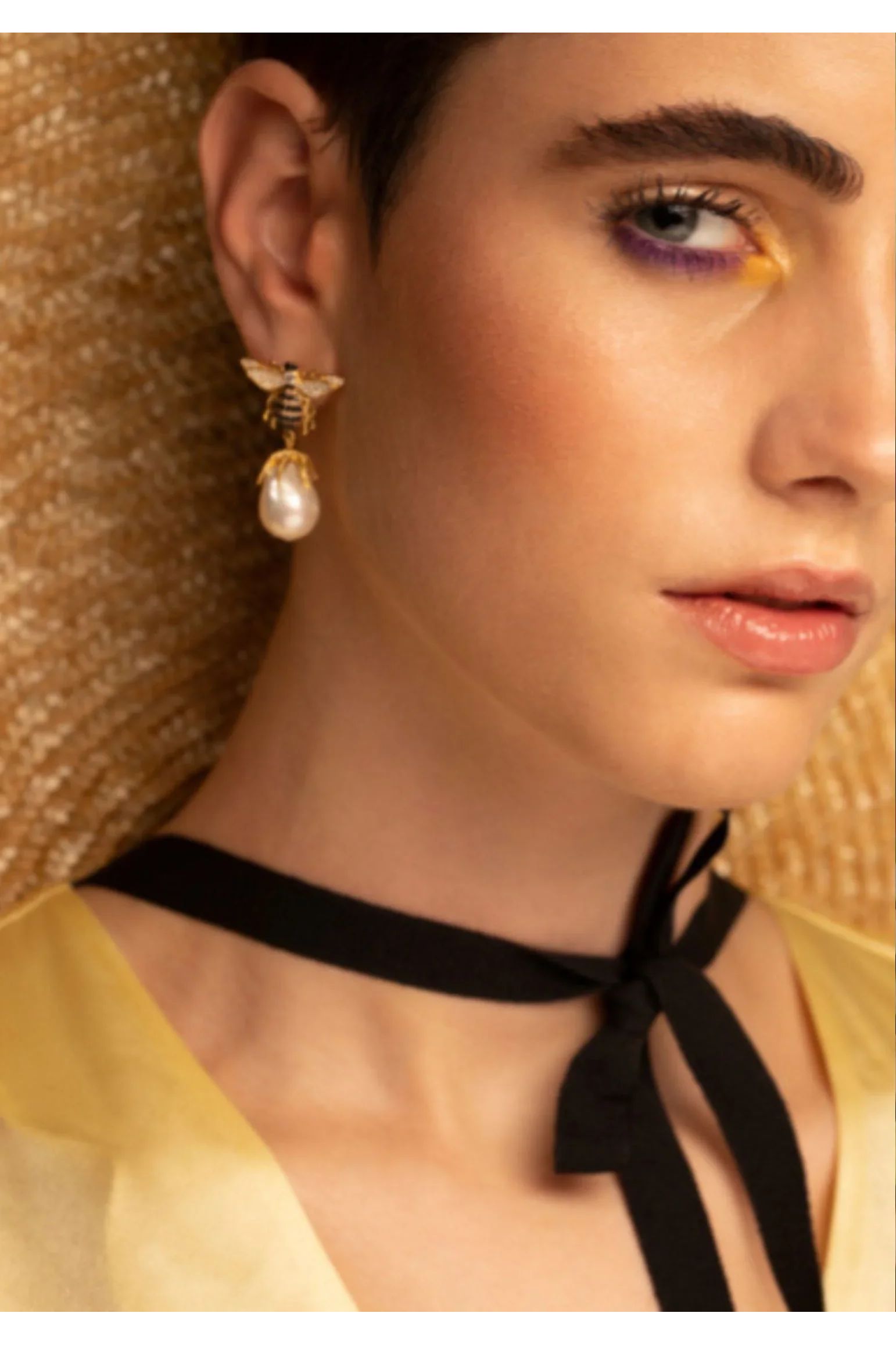 The earring worn by a model.