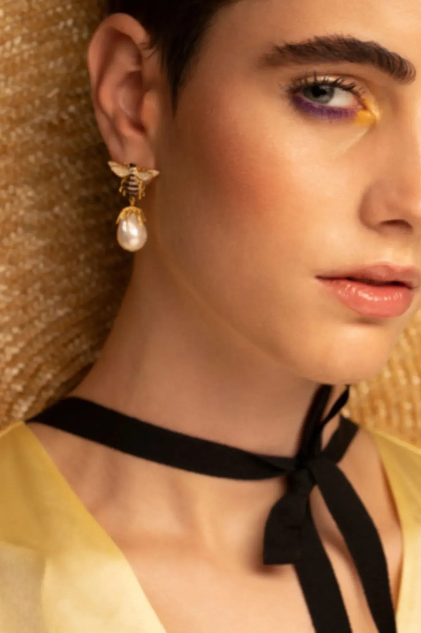 The earring worn by a model.