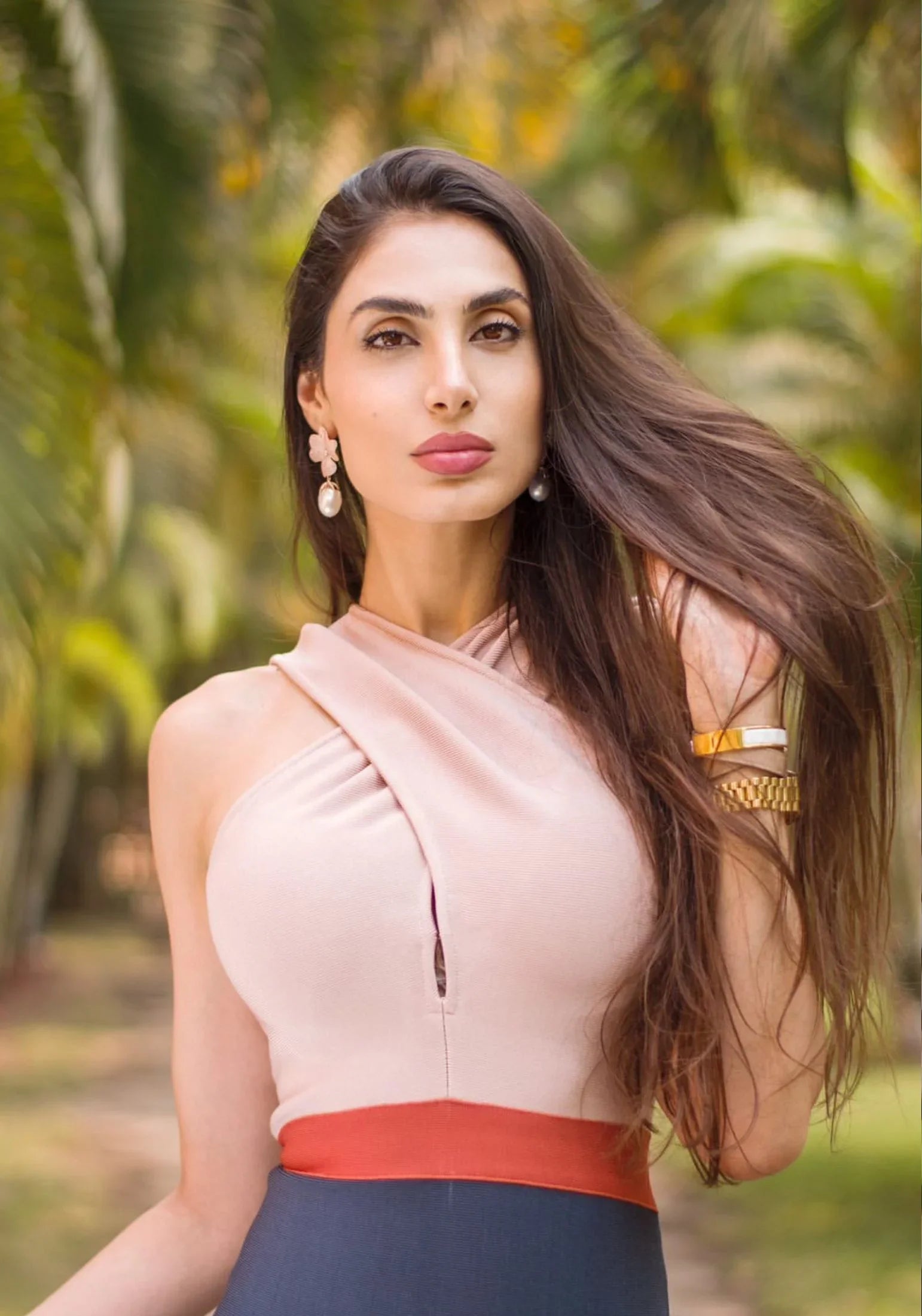 The earring worn by a model.