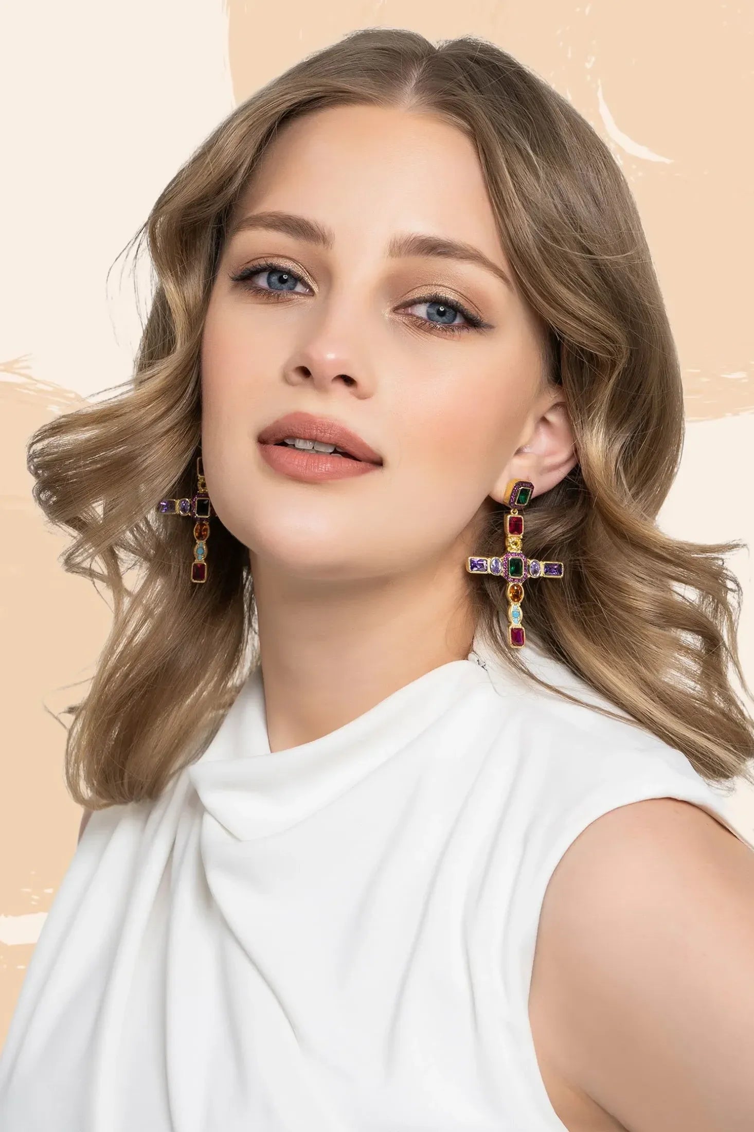 Maria Extra Large Gemstone Fashion Earrings Gold (Cross) worn by a model, showing how they sit on the ear and their scale.