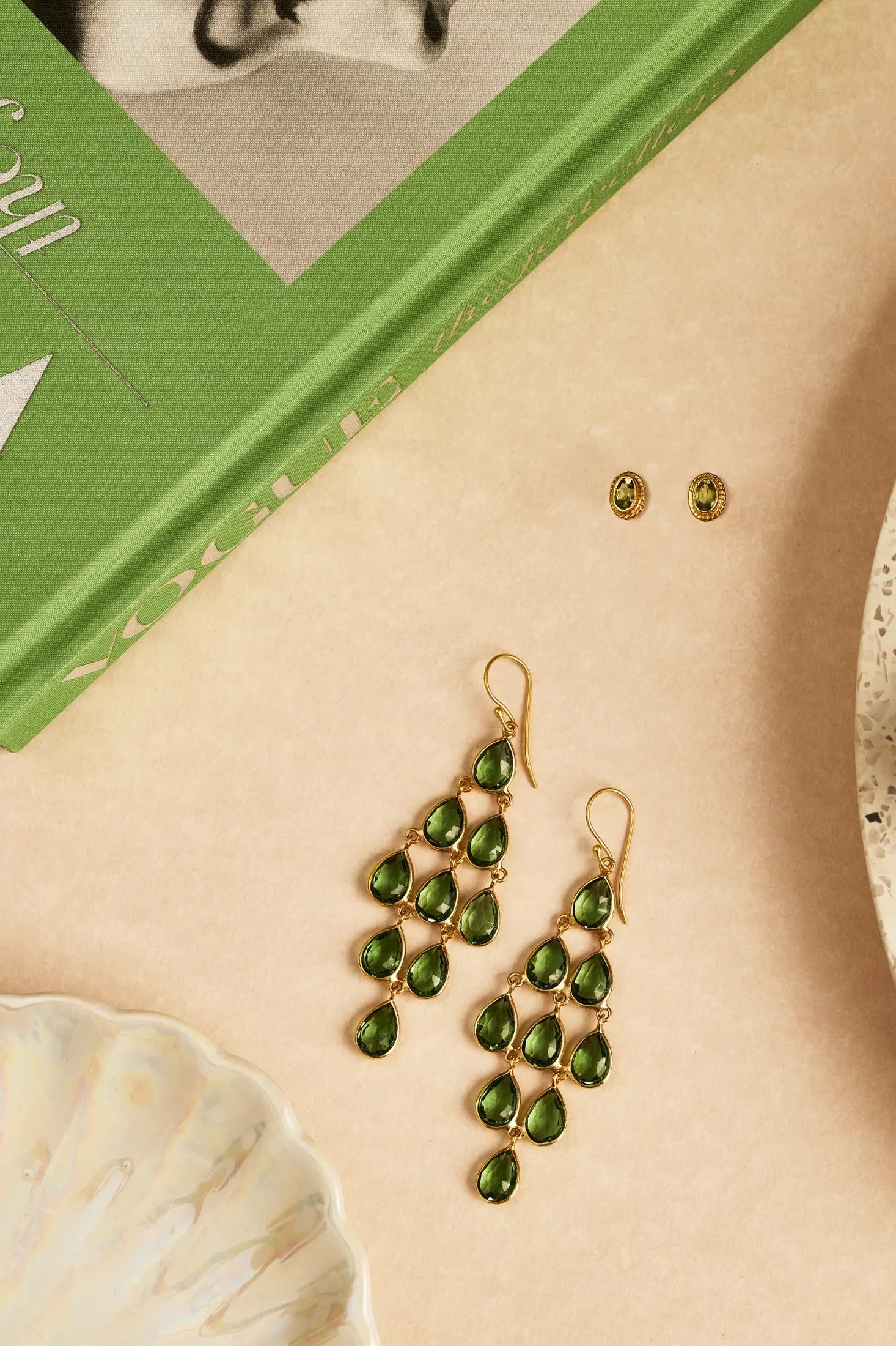 Erviola Gemstone Cascade Earrings Gold Peridot worn by a model, showing how they sit on the ear and their scale.