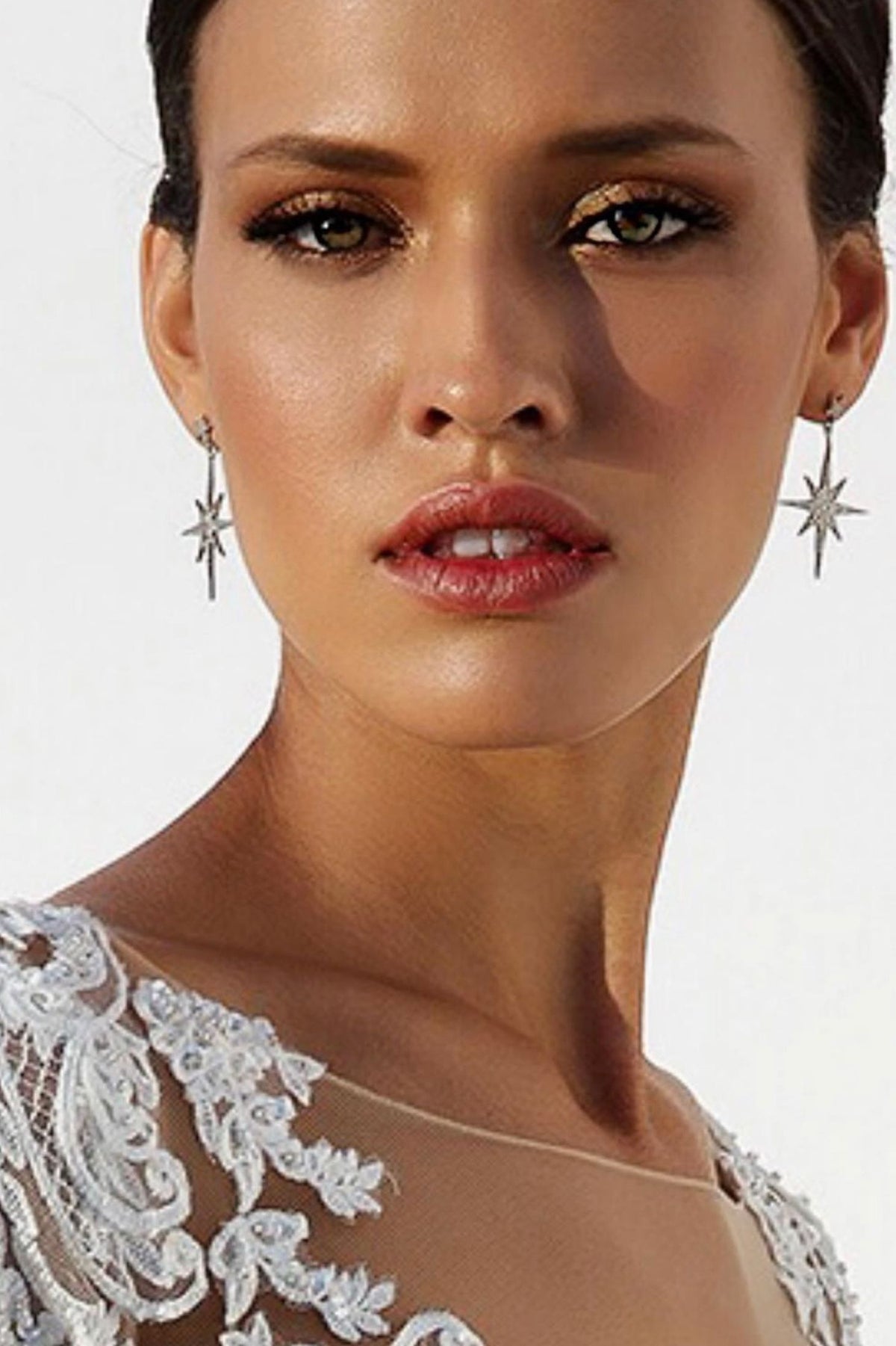 The earrings worn by a model.