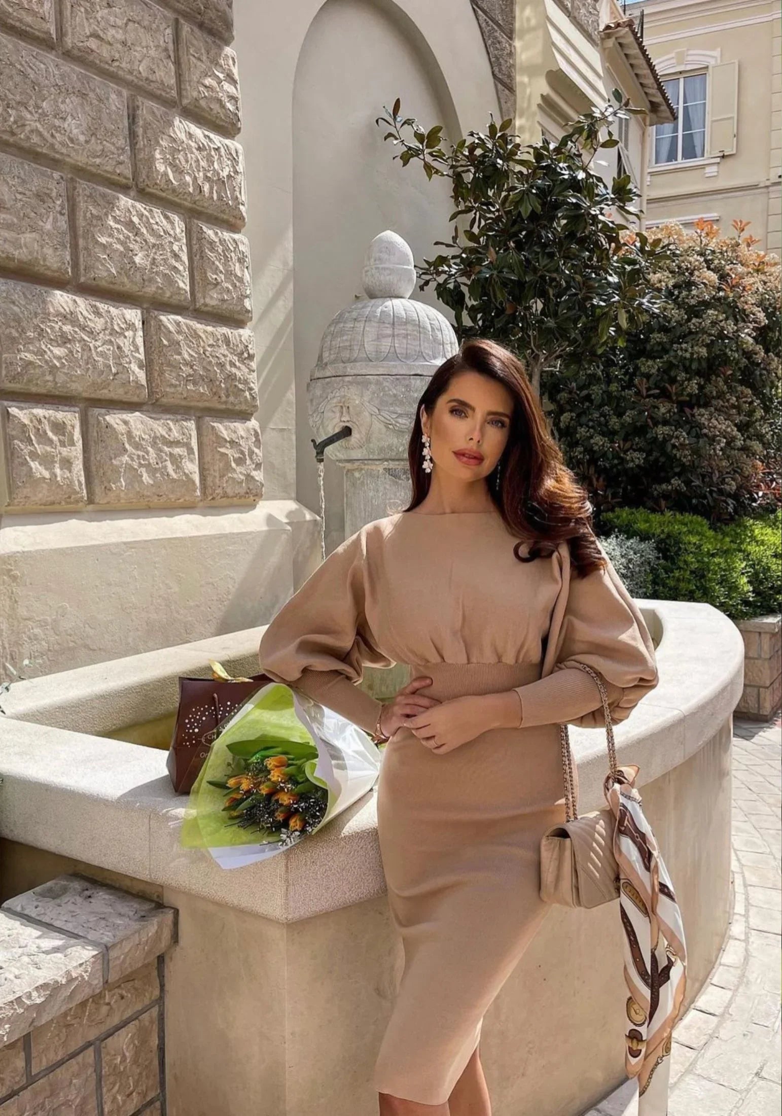 The earring worn by a model.