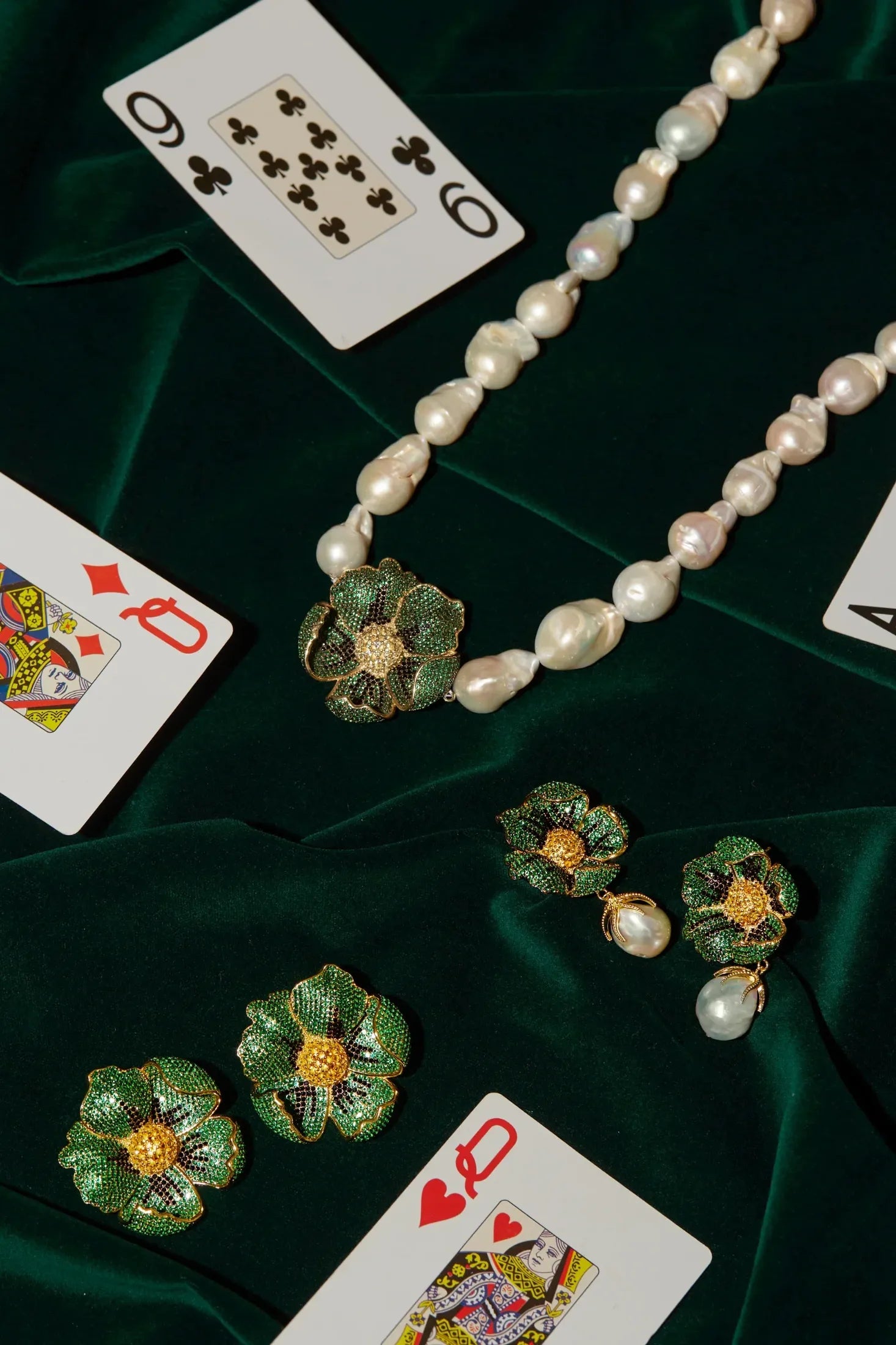 Poppy Flower Baroque Pearl Necklace Emerald Green Gold worn by a model, showing the pendant scale and how the chain sits.