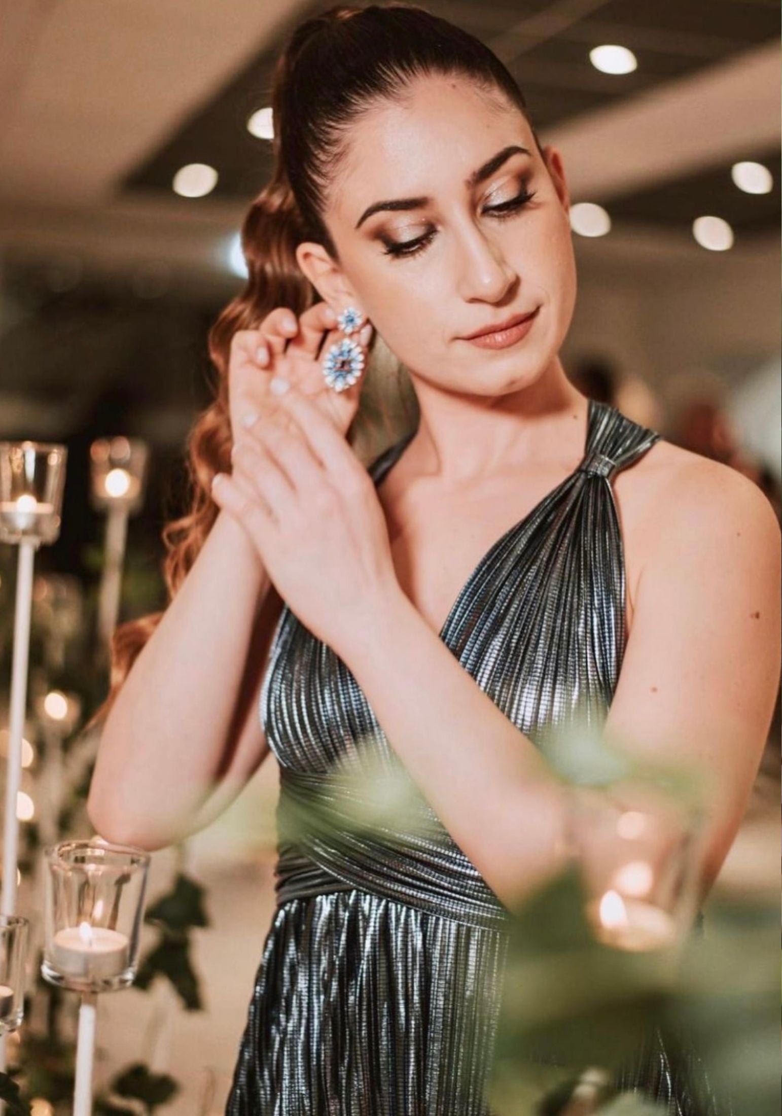 The earring worn by a model.