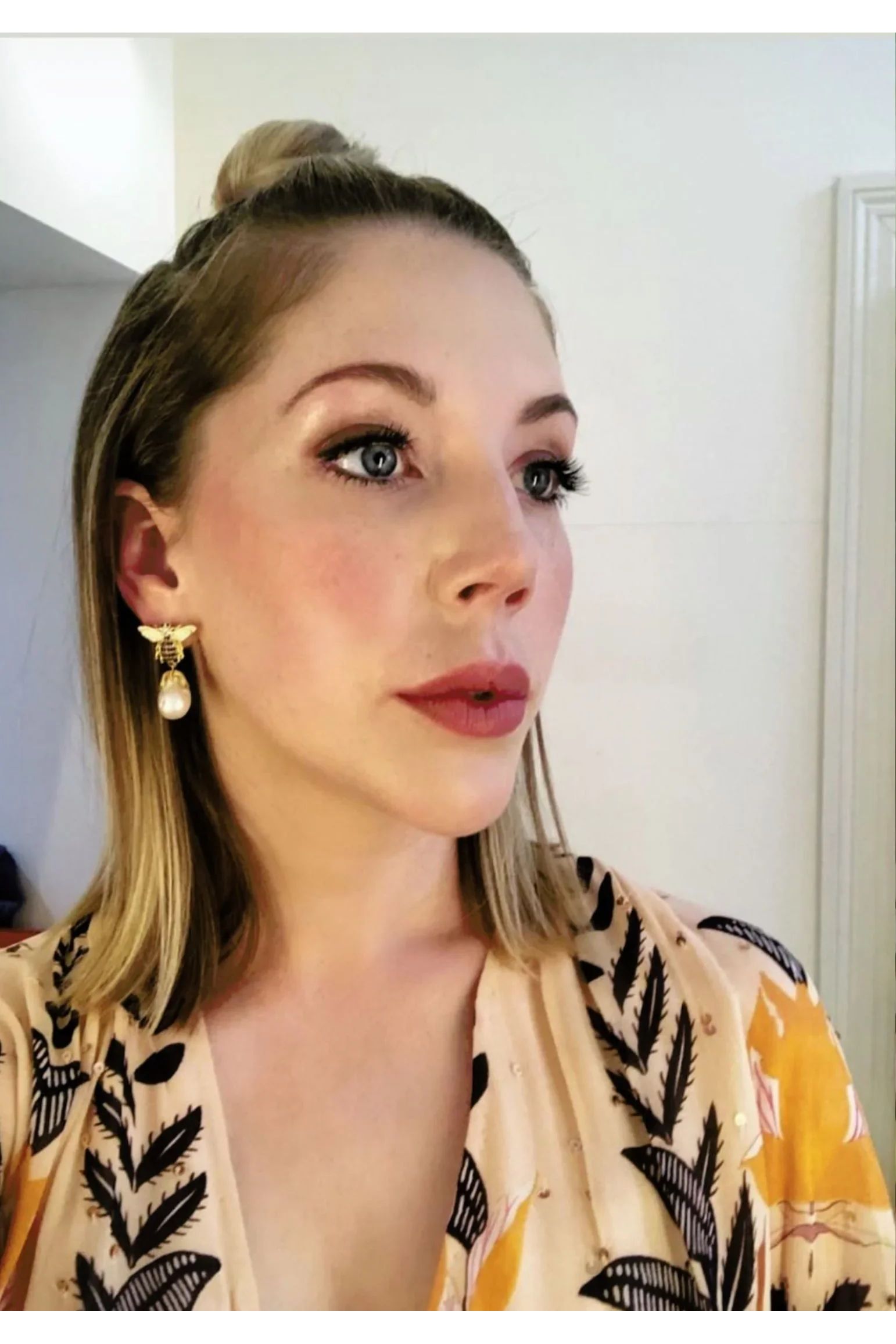 The earring worn by a model.