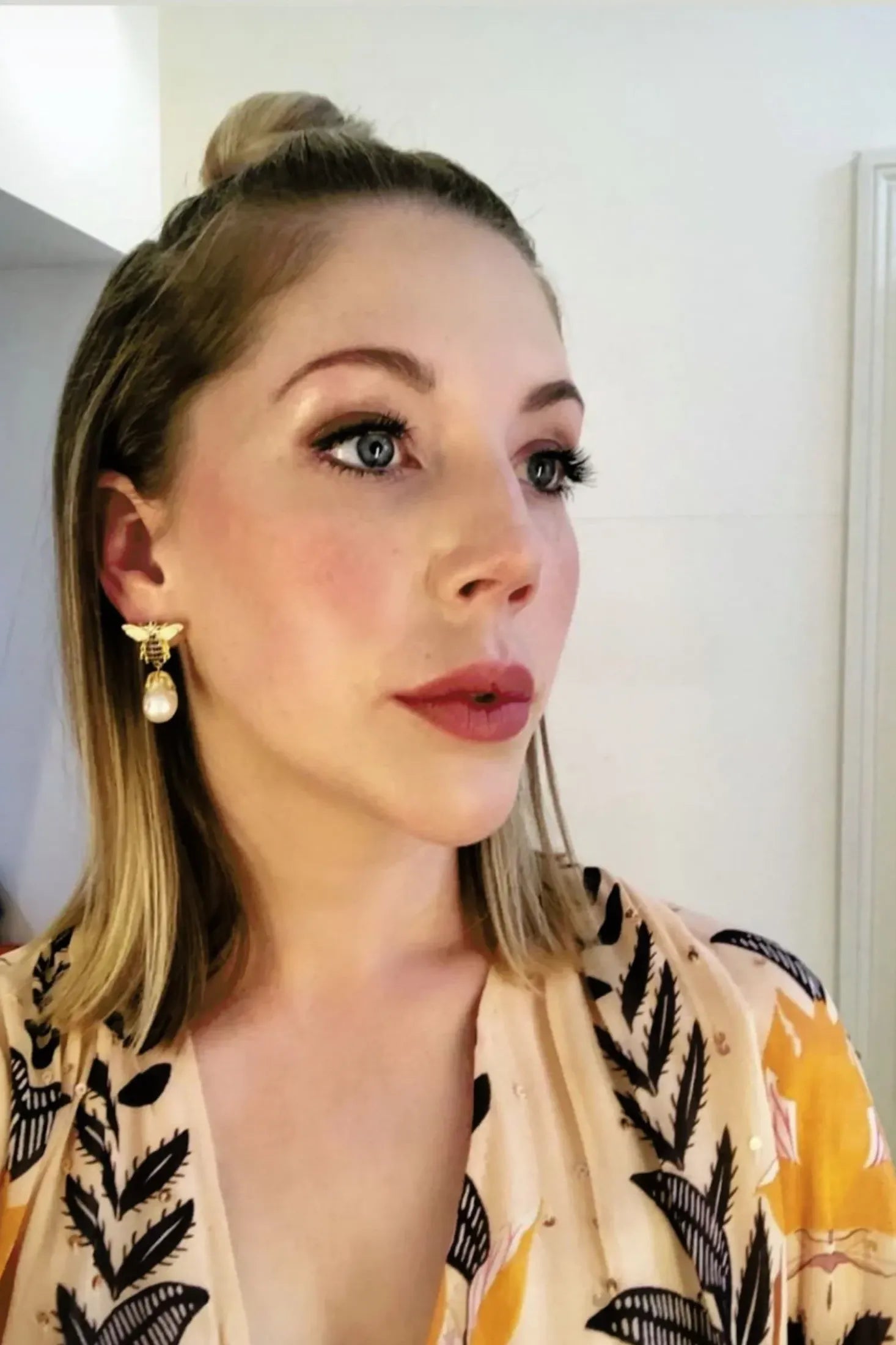 The earring worn by a model.