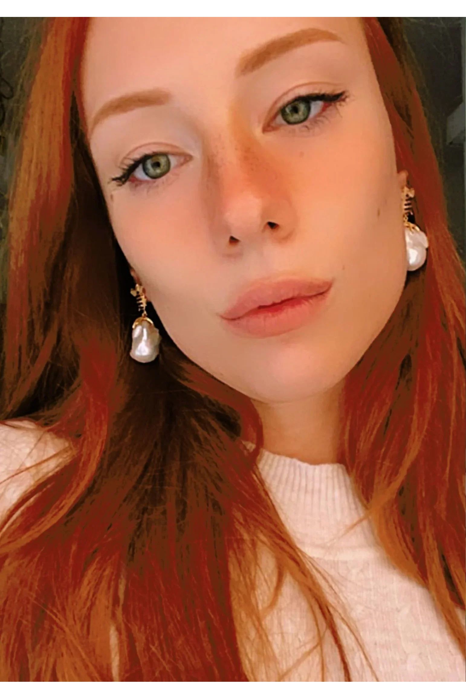 The earring worn by a model.