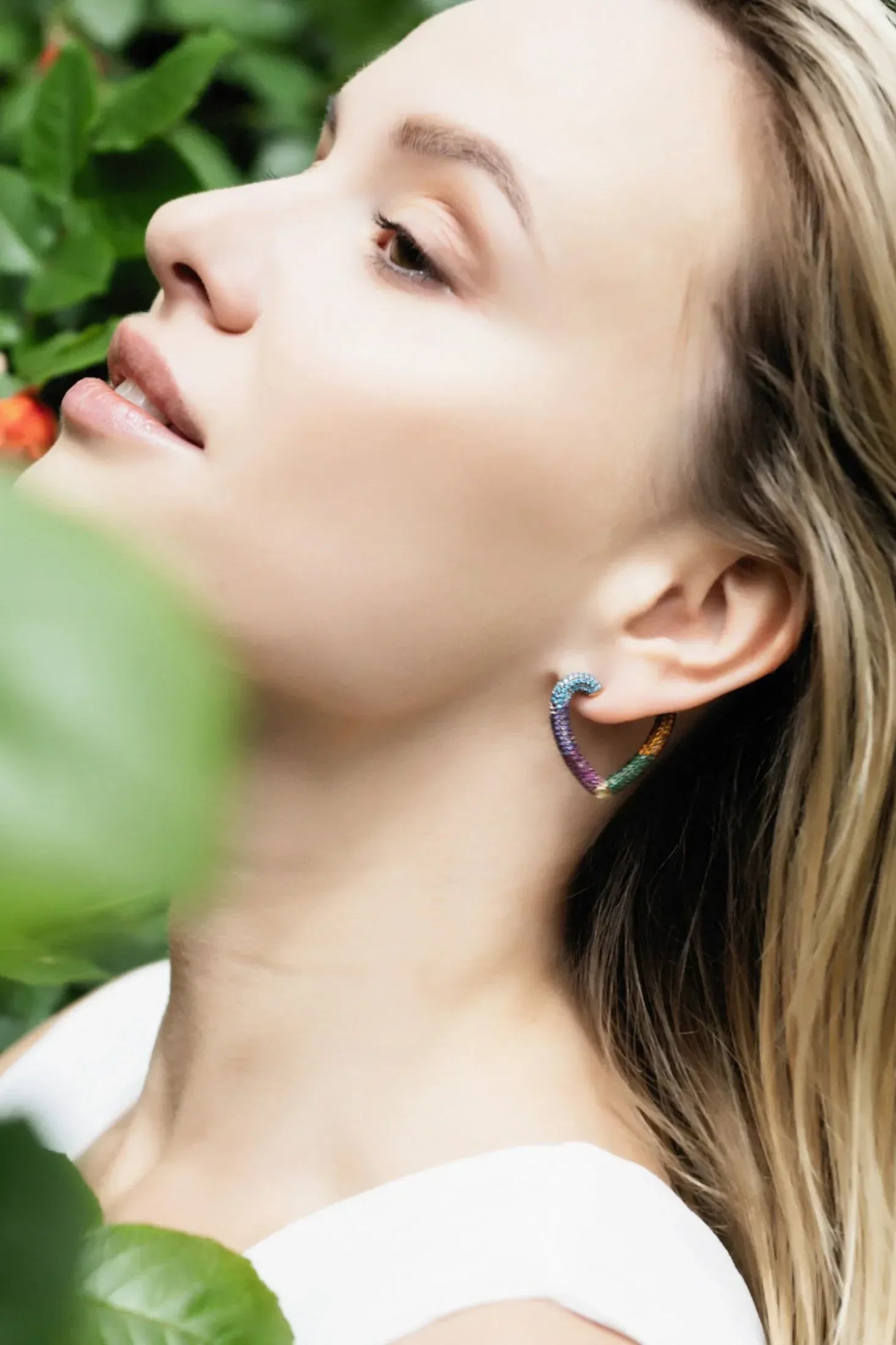 The earring worn by a model.