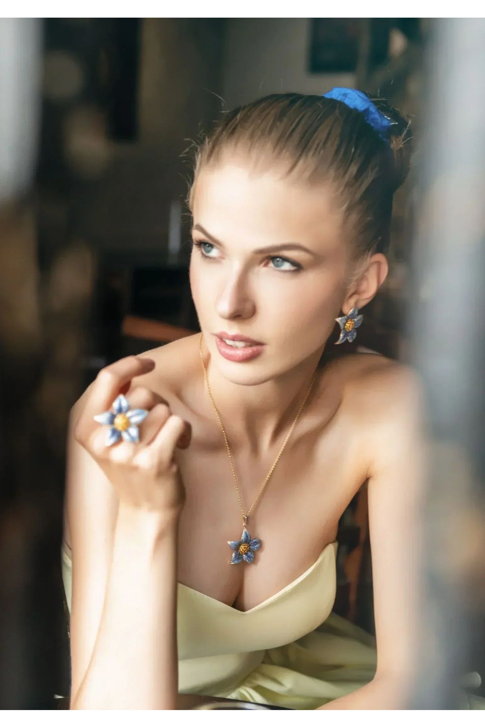 Flower jewelry set worn by a model.