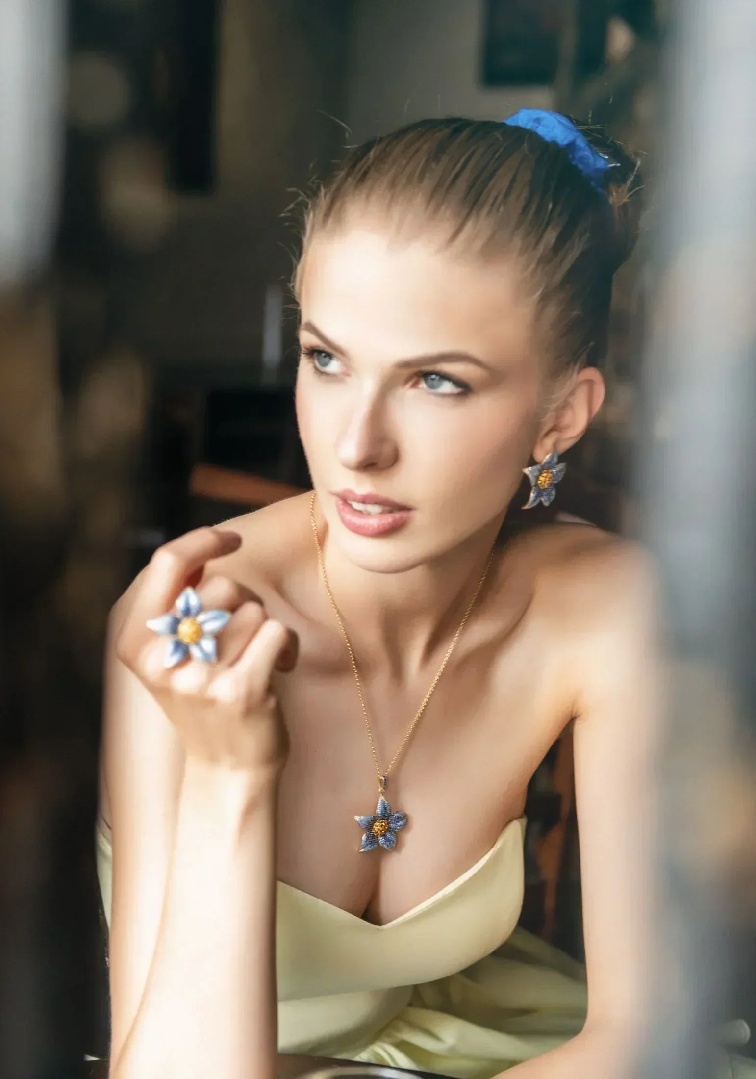 Flower jewelry set worn by a model.