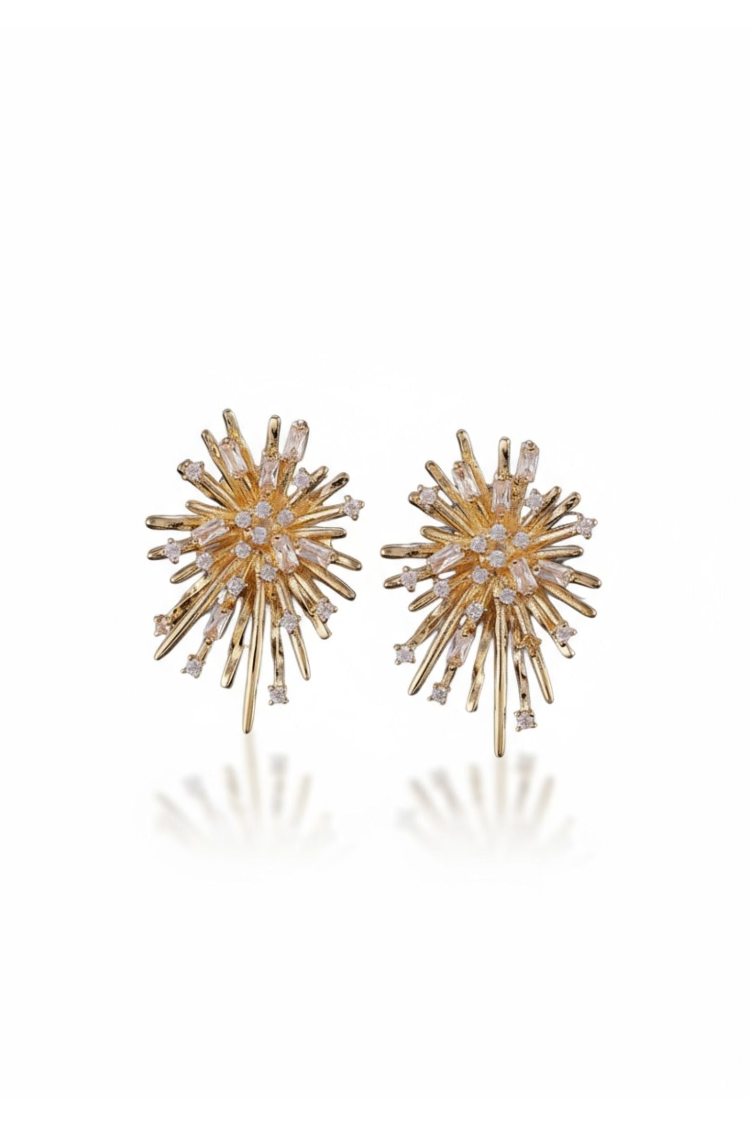 Gold starburst stud earrings.
