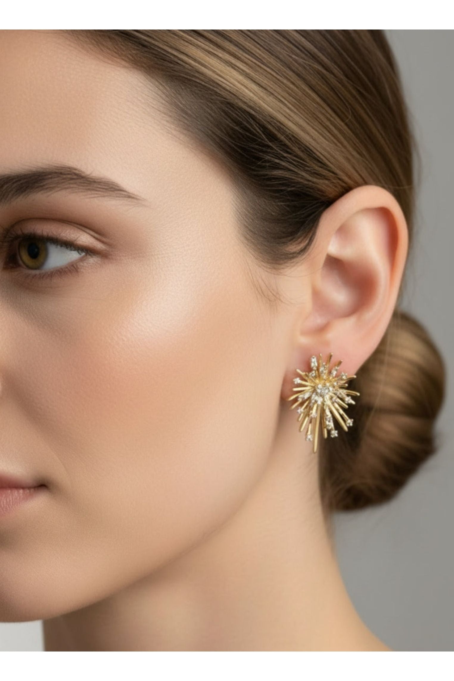 The earring worn by a model.