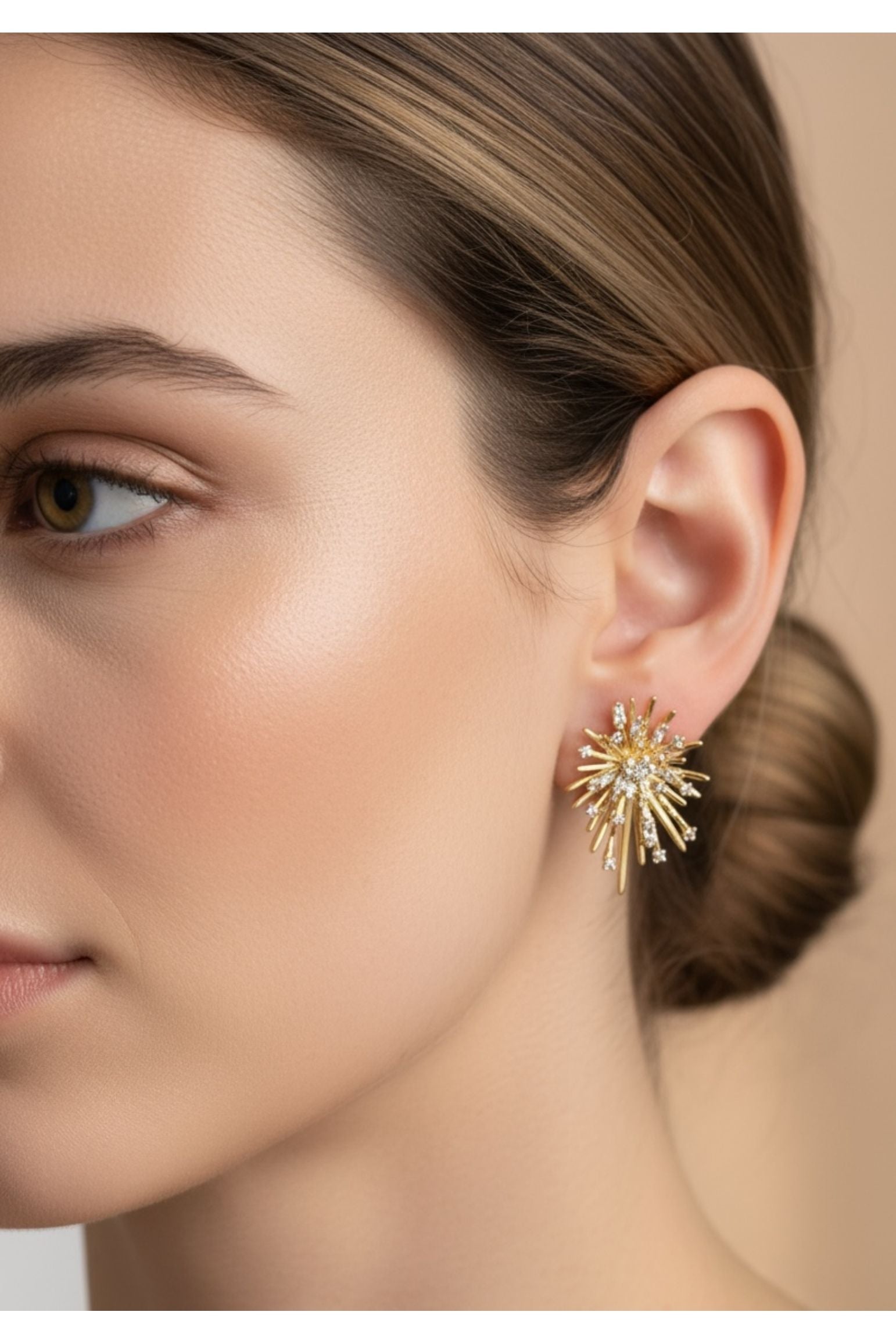 The earring worn by a model.